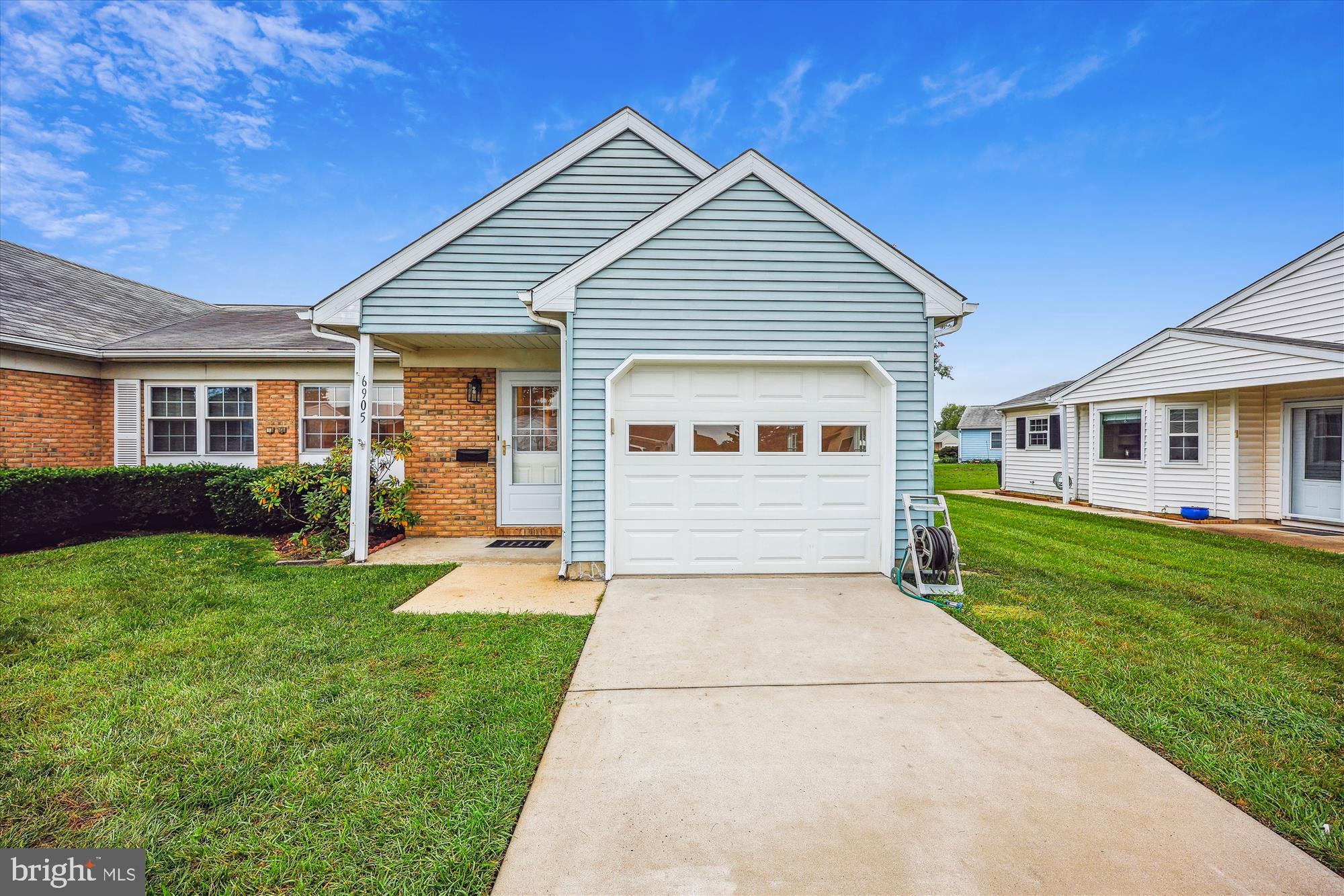 Completely transformed two-bedroom semi-detached patio home with one-car garage in the highly sought-after, 55+ active adult, pet-friendly community of Crestwood Village. Accessible home with no steps inside or outside of the unit. This home rests on a quiet cul-de-sac with private driveway, yard, and side patio overlooking a greenspace common area. Recent renovations include custom painting, new luxury vinyl plank (LVP) flooring throughout the home, crown molding, remodeled kitchen and bathrooms, new LED recessed lighting and fixtures, Simonton tilt-in vinyl replacement windows, blinds, replacement exterior doors and storm doors. Covered front portico entrance into foyer with coat closet and access from garage; open living room with recessed lighting and corner fireplace with slate hearth surround; kitchen with painted cabinets, quartz countertops, under-mount sink, upgraded appliances, and recessed lighting; open den or dining area outside kitchen creating flexibility with floorplan; dining room or family room with three walls of windows, new chandelier, and outdoor access to concrete patio; hallway with recessed lighting, pull-down attic access ladder, and double-door pantry/linen closet; remodeled half bath with new vanity, lighting, storage cabinetry, and separate laundry closet with full-size washer & dryer inside; two bedrooms with LVP flooring, recessed lighting and walk-In or double-door closets; renovated full bathroom with walk-in shower, all new over the john cabinet, vanity with marble countertop and integral sink, vanity light, and mirror; BONUS one-car garage with finished & painted walls/ceiling with epoxy-painted flooring. Crestwood Village’s outdoor amenities include a community pool, a miniature golf course, tennis courts, and shuffleboard. Additionally, there is a gorgeous clubhouse featuring a computer room, library, fitness room, locker rooms with saunas, pool tables, table tennis, kitchen, and several meeting rooms. Located minutes from downtown Frederick as well as multiple local shopping centers with a community shuttle bus making scheduled runs to each. Low HOA fee of $191 per month covers lawn care, trash removal, basic cable TV, and security.