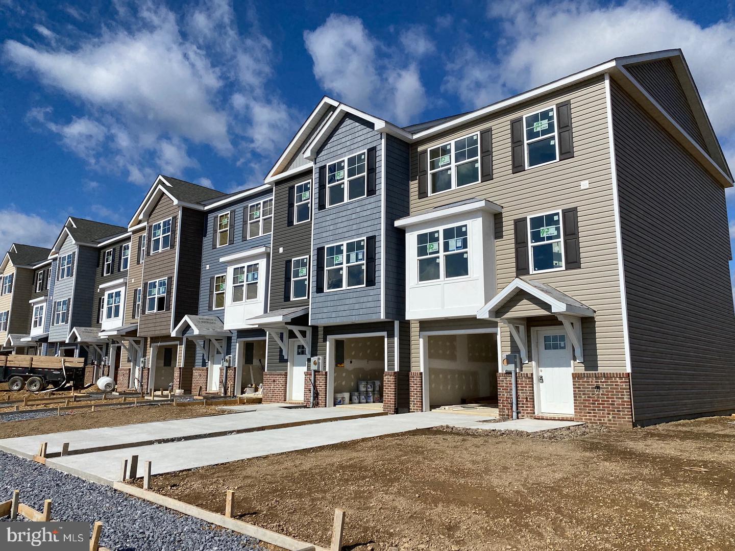 FOR IMMEDIATE RENT! Located in the Heritage Hills Community in Martinsburg, this townhome features 1975 sqft of finished living space and 4 BR/ 3.5 BA. Laminate LVP Flooring throughout the main level. Upgraded kitchen with eat in dining, granite countertops, upgraded white cabinets, pantry, island and stainless steel appliances. Primary bedroom includes vaulted ceilings, walk-in closet, lien closet and private bath. Also featured are two additional bedrooms, full hall bath and laundry on the bedroom level. The fully finished lower includes an additional 4th bedroom and full bath. Natural Gas Community. Great commuter location with easy access to I-81 and Route 9. Close to shopping and restaurants; minutes from Foxcroft Towne Center and The Commons in Martinsburg. Applicant(s) must be able to pass credit/background check. Pets are case by case. No Smoking. Security deposit and first month rent upfront. Call to schedule your tour!