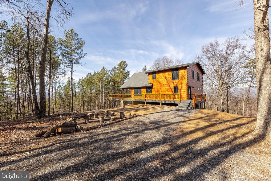 HATE TO WAIT? BRAND NEW CUSTOM LOG HOME ON 40 PRIVATE ACRES WITH LONG RANGE PANORAMIC WESTERN VIEWS. IF YOU'VE BEEN DAY DREAMING OF AN AWESOME MOUNTAIN HOME BUT DON'T WANT TO WAIT A YEAR OR TWO FOR A REPUTABLE BUILDER, DEAL WITH CONSTRUCTION HEADACHES, SKYROCKETING MATERIAL & LABOR COSTS AND UNSTABLE SUPPLY CHAINS......THEN YOUR SHIP HAS COME IN.....BUILT BY THE AREAS PREMIER AND MOST SOUGHT AFTER BUILDER "BRYSON HOMES" THE QUALITY AND ATTENTION TO DETAILS ARE EVIDENT. THE HOME FEATURES HIGH END HARDWOOD FLOORING, QUARTZ COUNTERS, WOOD BURNING FIREPLACE, COMPOSITE DECKING, LED LIGHTING, ETC. LOCATED AT THE DEAD END OF THE ROAD AND PERCHED ON A RIDGE WITH NO NIEGHBORS IN SIGHT....EVER.....SO QUIET AND SO PRIVATE.....COMPRISED OF 2 ADJACENT 20 ACRE TRACTS, SO IF YOU HAVE A FRIEND OR FAMILY MEMBER YOU'D LIKE TO HAVE AS A NEIGHBOR, YOU'LL HAVE SOMEWHERE TO PUT THEM. ROLLING LAND, COVERED IN OAKS AND GORGEOUS LOBLOLLY PINES, GREAT FOR HUNTING, SHOOTING & ATV'S. STAY CONNECTED WHILE YOU DISCONNECT WITH STARLINK INTERNET AND GREAT CELL SERVICE. LOCATED IN THE PRESTIGIOUS GATED COMMUNITY OF "THE BLUFFS ON THE POTOMAC".....THE BLUFFS IS KNOWN FOR IT'S ABUNDANCE OF BIG BUCKS, BEAR & TURKEY. AS AN ADDED BONUS, THE COMMUNITY HAS IT'S OWN PRIVATE COMMON AREA ON THE SOUTH BRANCH OF THE POTOMAC RIVER FOR CANOE, KAYAK, TUBES, FISH & SWIM......A PRIVATE PARK ON THE RIVER FOR YOUR SUMMERTIME ENJOYMENT. WHO SAYS PATIENCE IS A VIRTUE?.....HAVE IT YOUR WAY TODAY! THE OWNER HAS DONE ALL THE HARD WORK AND DEALT WITH ALL THE HEADACHES ....ENJOY THE FRUITS OF THEIR LABOR AND LIVE THE DREAM NOW!