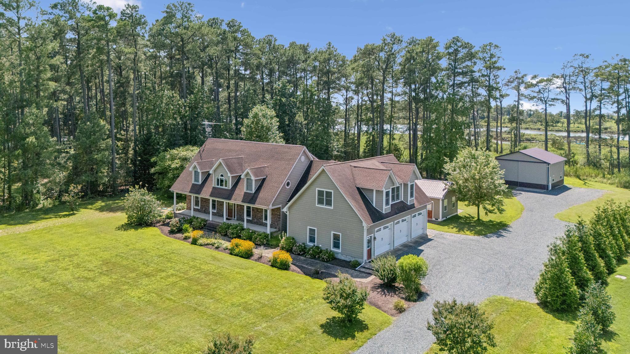 Waterfront home situated on Back Creek in Sherwood, offering direct access to the Chesapeake Bay and Choptank Rivers. Conveniently located near St Michaels and Tilghman Island, the property includes views of sunsets over Poplar Island and is located minutes from restaurants, and shopping. Interior features include hickory hardwood floors, custom built-ins, crown molding, and recessed lighting. The kitchen is equipped with stainless steel appliances, a built-in pantry, and granite countertops. The open floor plan incorporates a gas fireplace and a formal dining room. The primary suite has a walk-in shower, soaking tub, and walk-in closet. An attached three-car garage provides additional space with an upstairs bonus game/theatre room. The backyard is built for fun with a swimming pool, an outdoor kitchen with bar area, gas fire features, a hot tub, and a pool house for storage. The property also includes a 30x30 pole building with concrete floors, as well as a dock with water, electricity, and a boat lift. New septic installed in 2025!