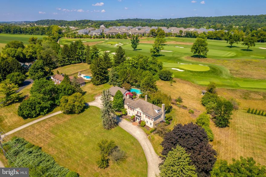 Welcome to 6005 Cricket Road, your once in a lifetime opportunity to own 2 acres with uninterrupted views of Philadelphia Cricket Club’s Wissahickon course. Perched on a hill, this lovely brick colonial looks out on the 16th green and 17th tee. Consisting of 5 bedrooms, 4 full baths and 2 half baths, with large first floor gathering spaces, including a library with gas fireplace, living room, dining room with adjoining sitting room with small wet bar, large eat-in kitchen and family room with wood burning fireplace. The second floor includes a large primary bedroom suite with walk-in closet,  and an updated bath with soaking tub and shower. Two secondary bedrooms with a jack and jill bathroom, a sitting room with additional closets and a fourth bedroom with bath and laundry access. The third floor has an additional bedroom and bath and attic access. The private rear patios and covered porches overlook the pool and hot tub area, the mature grounds and the golf course. The three-car garage with second story provides ample storage and room to expand. A property this special doesn’t come on the market very often. Conveniently located in Flourtown with easy access to Chestnut Hill, Lafayette Hill, Plymouth Meeting, Fort Washington State Park and the Green Ribbon Trail just down the block. Don’t let this opportunity pass you by!