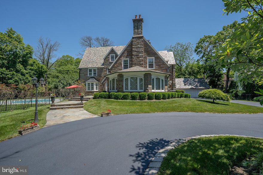 Beautiful Stone Colonial on a 0.67-acre corner lot in sought-after Merion Station features 7 bedrooms, 4 full bathrooms, 2 half baths, and a huge, level, landscaped, fenced-in yard with a pool! The large formal living has hardwood floors that flow throughout, a wood-burning fireplace, and crown molding that leads to the formal dining room which is perfect for hosting gatherings both large and small.  Spacious kitchen with tons of cabinet space, pantry, double oven, 2 dishwashers,  breakfast room, and access to the oversized back deck.  Cozy sunroom with brick floors and a convenient half bathroom complete this level.  Up the stairs to the second floor is the primary bedroom suite with a large closet, sitting area, and full bath, a large 2nd bedroom with a full ensuite bath, 2 additional bedrooms, and a hall bath.  The third floor has 3 bedrooms, a full hall bath, and additional storage.  Finished lower level with playroom, a prohibition bar, another half bath, a laundry room, and 2 storage rooms. 3-car garage and a large circular driveway. Located in the award-winning Lower Merion School District.  Close to dining and shopping areas of Wynnewood, and Merion and a  quick commute to Center City. Walk to train, public transportation, houses of worship and all downtown  Narberth has to offer!  This home has it all, schedule your viewing today!