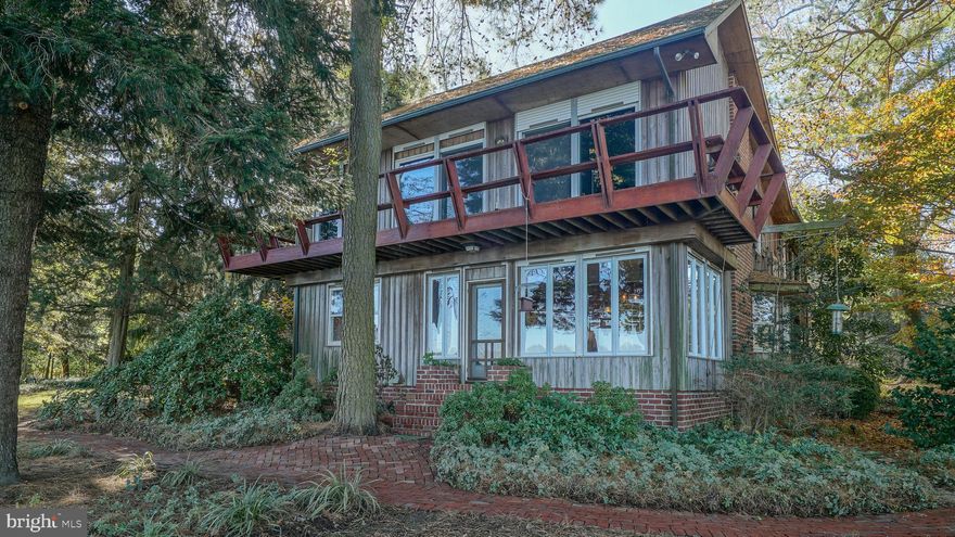 Priced to support its second owners to reinvigorate this charming spot on the Sassafras River. This uniquely-styled Cypress clad 40 year old waterfront with mature landscaping has great bones and provides the perfect urban escape (4 airports and Amtrak within 70-90 minutes) Today. you can picture a seasoned novelist finishing up his next NYTimes best seller sitting in the book filled library within the master bedroom or at the paper filled dining table!  Situated between two award winning architectural residences. Dock permit available.