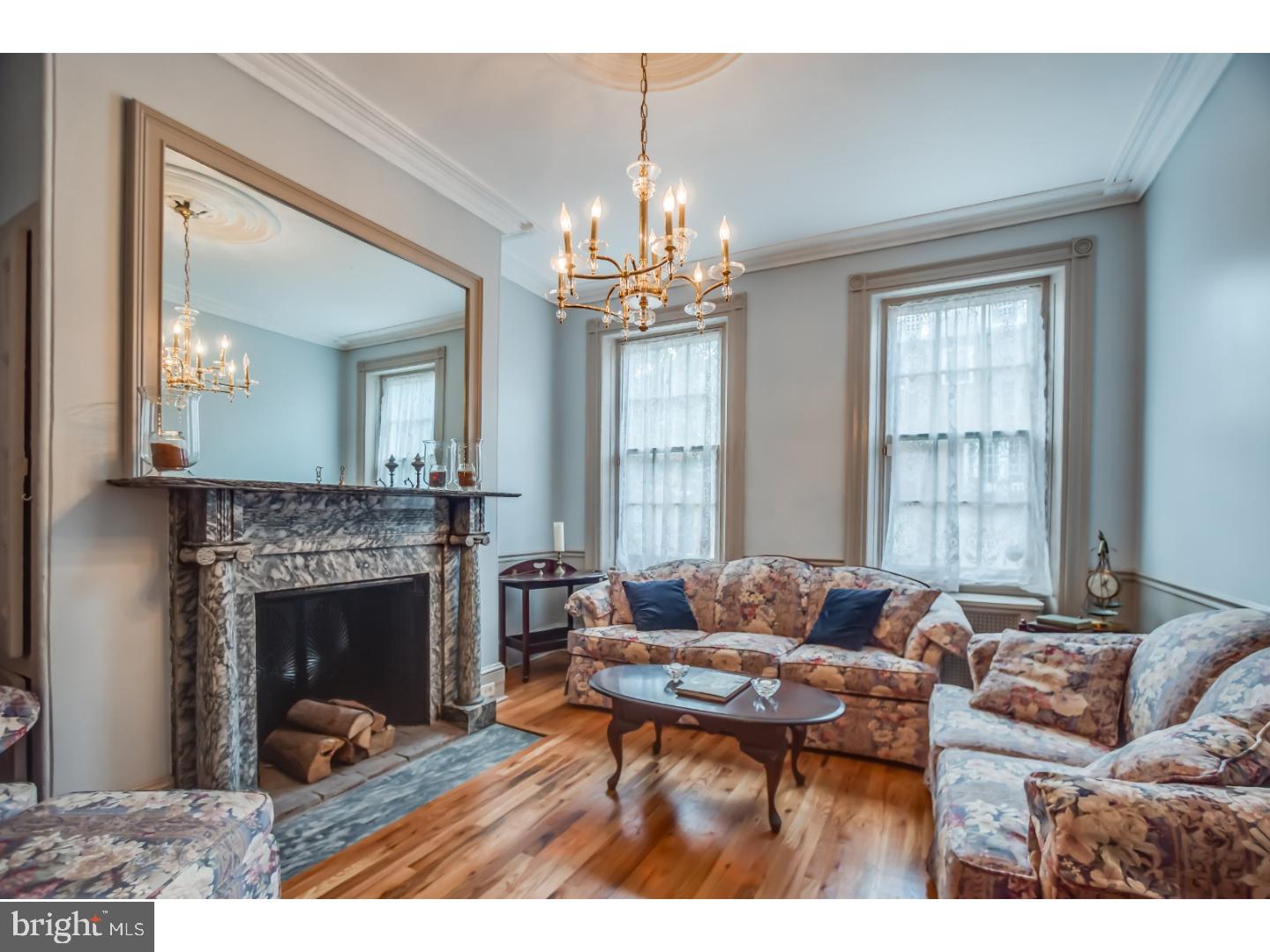 This remarkable 5-6 bedroom 2.5 bath home is full of character and gorgeous original details. This extra wide Federal Period Style home boasts memorable details such as 7 decorative stunning fireplaces with marble and handcrafted wood mantels, lovely medallions and moldings, high ceilings, hand carved wooden doors, an impressive staircase, random width hardwood floors, and striking stained glass accents.  The elegant vestibule entrance leads to a classic parlor room, an incomparable grand formal dining room, a newly remodeled custom bath and a fully equipped kitchen with a Viking range, breakfast bar and access to the beautiful garden. The second level presents a sweeping master bedroom with  a sitting room or an additional bedroom, built in bookshelves, a walk in closet and a newly remodeled bathroom with a tiled shower.  Two additional spacious bedrooms are located on the 3rd level and two more are located on the 4th level.  The lower level is partially finished with a sitting room, bedroom area and half bath - a possible au pair or in-law suite.  One year pre-paid parking at the lot at Front and Christian Street 1.5 blocks away.  Easy access to 95 &76.  Conveniently located near restaurants, parks, hospitals, & the Financial District.