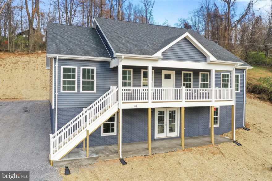 BIGGER PRICE DROP!!!! BUILDER MOTIVATED TO CLOSE IN 2025, due to other constructions.
Welcome to your brand-new mountain home in the heart of Front Royal!  This modern home offers the perfect blend of style, comfort, and convenience as it is just 10 minutes to I-66.  Enjoy this home on the inside with its vaulted ceilings and airy living area with window views of the mountains AND even better 
panoramic mountain views from the second story front porch and from the walk-out basement.
The thoughtful one-level floor plan includes 3 spacious bedrooms and 2 full baths with tiled showers. Soft close kitchen cabinets, quartz counters, and luxury vinyl planked flooring throughout.
The owner’s suite is privately situated on one side of the home, offering a true retreat with a large walk-in closet and a luxury en-suite bath featuring a walk-in tile shower and dual vanities. 
Two additional bedrooms and a full bath are located on the opposite side, providing privacy and comfort for family or guests.
The kitchen features stainless steel appliances, soft close cabinets, quartz counter tops and an island with seating capability and easy access to the dining area with sliding glass doors that lead to a private back patio—perfect for morning coffee or evening relaxation.
Interior stairs lead to a full walk-out basement with glass french doors and rough-in plumbing, offering endless possibilities for future expansion.
Located just minutes from Shenandoah National Park, Skyline Drive, and Shenandoah River access points. This home combines tranquility with convenience to I-66, shopping, and dining. Don’t miss the chance to own this brand-new home at a fantastic price with modern finishes and room to grow—all in a peaceful and convenient location.