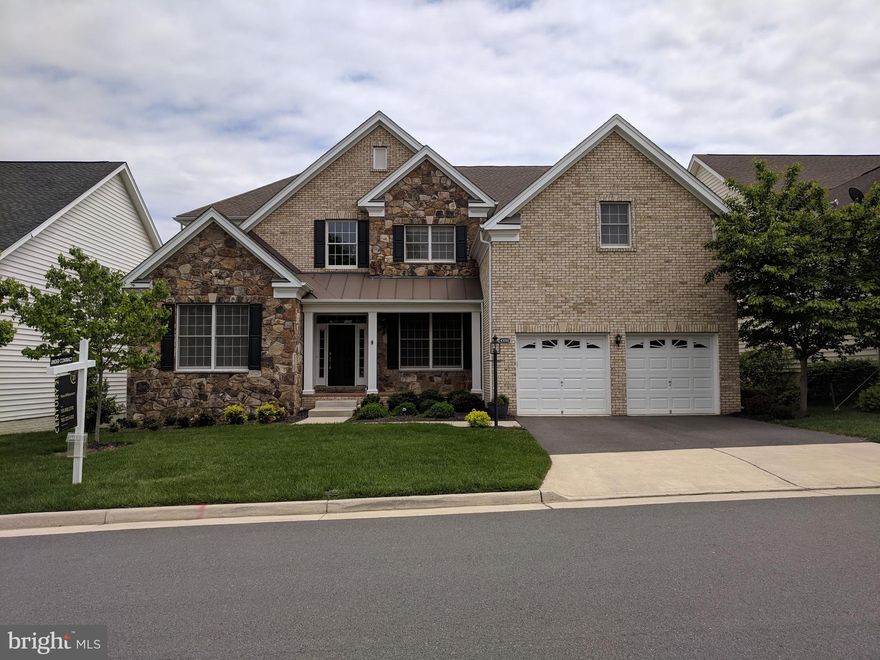 Colombia model with lots of upgrades and bumpouts. Professionally built patio and deck added by seller. Media room in lower level could easily be converted back to legal 5th bedroom.