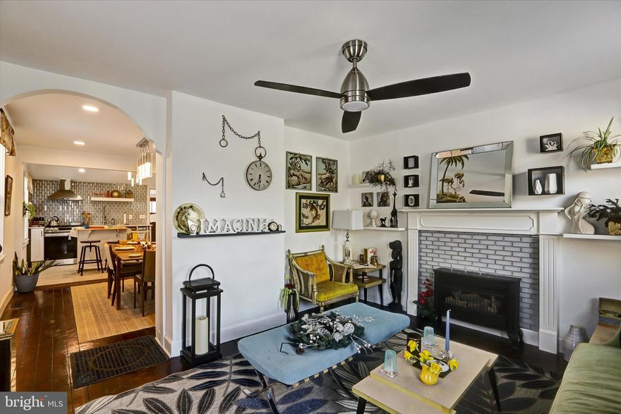 Beautifully renovated Hampden end‑of‑row home rebuilt from the studs with all new plumbing, electric, insulation, and tilt‑in windows. Features include a bright living room with a gas fireplace, a modern kitchen with quartz counters and stainless steel appliances, a 4‑season bonus room, and a lofted primary bedroom. The bathroom has heated floors. The lower level offers a partially finished space with a new washer/dryer, utility sink, gym area, and egress. Exterior upgrades include new siding, a new metal roof, a landscaped yard with a fire pit, and off‑street parking. Across from Roosevelt Park with a protected view and steps to The Avenue and I‑83.