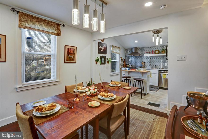 Beautifully renovated Hampden end‑of‑row home rebuilt from the studs with all new plumbing, electric, insulation, and tilt‑in windows. Features include a bright living room with a gas fireplace, a modern kitchen with quartz counters and stainless steel appliances, a 4‑season bonus room, and a lofted primary bedroom. The bathroom has heated floors. The lower level offers a partially finished space with a new washer/dryer, utility sink, gym area, and egress. Exterior upgrades include new siding, a new metal roof, a landscaped yard with a fire pit, and off‑street parking. Across from Roosevelt Park with a protected view and steps to The Avenue and I‑83.