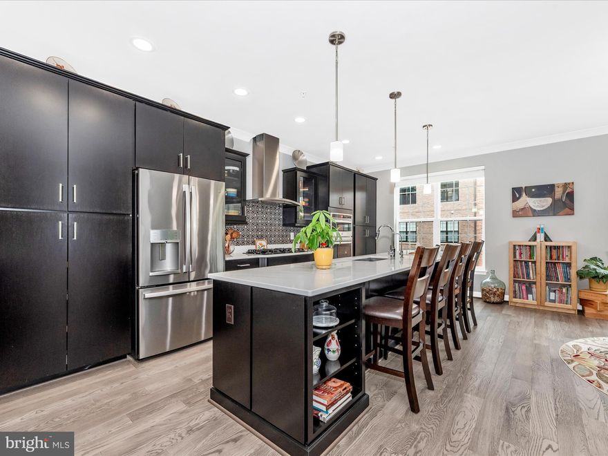 Skip the commute and enjoy luxury living just 10 minutes from DC and Alexandria, VA! Welcome to 521 Triggerfish Drive in the exclusive Potomac Overlook at National Harbor, offering the perfect blend of convenience, lifestyle, and upscale living without DC or Northern Virginia pricing. This stunning 4,100+ sq ft residence presents a rare opportunity to assume a VA loan at 2.875%, delivering exceptional value in today’s market. As one of the only homes in the community with a builder bump-out, this property offers expanded living space and a spacious open-concept layout. Inside, you’ll find hardwood floors, crown molding, abundant natural light, and high-end finishes throughout. The gourmet kitchen is beautifully appointed with stainless steel appliances, a gas cooktop, wall oven, custom walk-in butler’s pantry, and a large center island with eat-in space. 
The spacious primary suite features custom walk-in closets and a newly renovated spa-inspired bath with dual vanities, a walk-in shower with dual shower heads, and premium finishes. Additional bedrooms and full baths on multiple levels—including a private lower-level suite—offer flexibility for guests, a home office, or multigenerational living. Notable upgrades include LED recessed lighting, epoxy garage flooring with added insulation, an EV charging station, and a whole-home water softener and filtration system. Built in 2021, this modern home also boasts private rooftop terraces, an upgraded bar with wine chiller, and a dual-sided fireplace for seamless indoor/outdoor entertaining.

Located in a secure, gated community with a walkable waterfront and easy access to National Harbor, MGM, Tanger Outlets, restaurants, and major commuter routes including I-295, I-395, and I-95, this home is also just minutes from Old Town Alexandria and Washington, DC. Schedule your private tour today!

*See attached highlight sheet for the full list of unique features and upgrades this beautiful home has to offer.