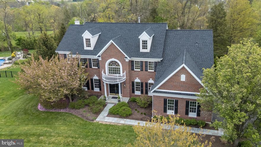 Open House Thursday, April 23; 5:00–7:00 PM. Welcome to 2517 Lockleigh Rd in the highly sought-after Estates at Dark Hollow. Set on a private, beautifully landscaped 0.86-acre lot, this impressive custom-built estate offers 4 bedrooms, 3.5 baths, and a seamless blend of timeless craftsmanship upgrades and modern comfort—all within award-winning Central Bucks School District. A newly installed bluestone walkway leads to a grand entrance, where a sweeping curved staircase and striking custom millwork create an unforgettable first impression. The formal living and dining rooms are elegantly appointed with crown molding, chair rail, wall sconces, and custom drapery—perfect for both everyday living and entertaining. A private office/library with custom built-ins provides an ideal work-from-home space. At the heart of the home, the expansive family room is filled with natural light from a dramatic wall of windows and anchored by a stunning stone wood-burning fireplace, flanked by custom built-ins. The adjacent kitchen features cherry cabinetry, granite countertops, stainless steel appliances, a brand-new backsplash, and a picturesque window overlooking the serene backyard. The bright breakfast room showcases a two-story bay window and sliding glass door leading to a freshly refinished deck—perfect for enjoying peaceful, park-like views. A rear staircase, spacious laundry room, and powder room complete the main level. Upstairs, the luxurious primary suite is a true retreat, offering a private sitting room with built-ins, two walk-in closets, and a spa-like bath with jetted tub, oversized shower, a dual granite vanity, and linen storage. One secondary bedroom includes an en-suite bath, while two additional bedrooms share a Jack-and-Jill bath with a dual vanity and a private shower/commode area. The expansive walkout basement offers incredible potential for future living space, featuring high ceilings, abundant natural light through three windows and two doors, a rough-in for a full bath, and direct access to a new bluestone patio—ideal for creating a fifth bedroom, guest suite, or entertainment area. Additional highlights include a new roof, newer HVAC systems, whole-house generator, new electrical panels, underground sprinkler system, new exterior shutters, and a 3-car garage with ample storage. The professionally landscaped grounds feature beautiful stonework and pathways, creating a peaceful, park-like setting. Enjoy direct access to the Warwick Township trail system for walking, running, and biking. Ideally located with easy access to NYC, Philadelphia, Doylestown, and New Hope, this home offers the perfect balance of luxury, privacy, and convenience. Schedule your private tour today—this is one you won’t want to miss.