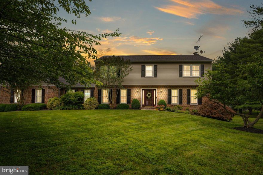 **A site unseen offer was submitted and accepted** Move-in ready 4BR/2.5BA Colonial located on a beautifully manicured lot in a desirable neighborhood.  Drive up the extra long driveway, park outside a two-car attached garage, and make your way past blooming landscaping to the front door of your forever home.  Enter into a spacious entry hall with a view of the living room on the right, dining room on the left, and down the hall into the heart of the home.  The extra large living room boasts plenty of natural light, hardwood floors, a two-tone color pallet and chair and crown moldings.  The dining room is spacious and ideal when hosting family gatherings with access to the stunning kitchen. A large family room features a wood burning fireplace with a brick hearth and wood mantel surrounded by custom built-ins. The kitchen is grand offering plenty of wood cabinets finished to the ceiling with crown moldings, a bank of pantry closets, black stainless appliances including a double oven electric range, granite countertops with a complementing backsplash, an island with pendant lighting, and not one but two coffee/serving bar areas.  Completing this floor is a half bath, a spacious breakfast area, and a home office boasting custom built-in cabinets, and access to the stunning yard.  On the second floor is a large primary suite offering two walk-in closets, and a private ensuite offering a double sink vanity and walk-in shower. Additionally, three primary sized bedrooms with ample closet space, and a full bath with access from the hallway or one of the three primary bedrooms.  The lower level offers additional living space with an oversized family room, storage, laundry, and a walk-out to the yard. From the main floor step out onto a large wood deck that steps down to another deck, with both overlooking the tons of green space and forest like surroundings in the yard.  This home is move-in ready with so much to offer new homeowners and is located within close proximity to shopping, restaurants, and commuter routes.