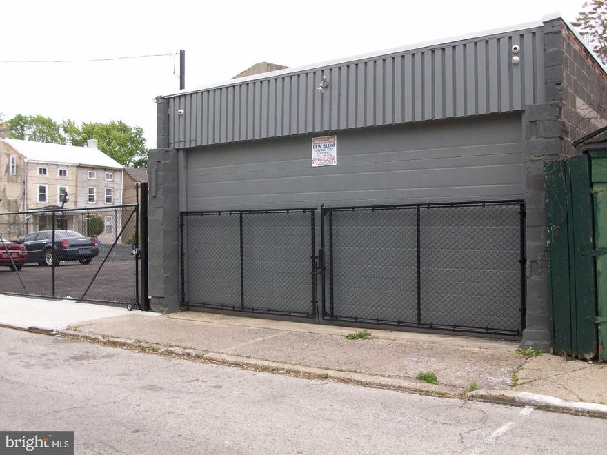 Rarely offered contractor garage with fenced in paking