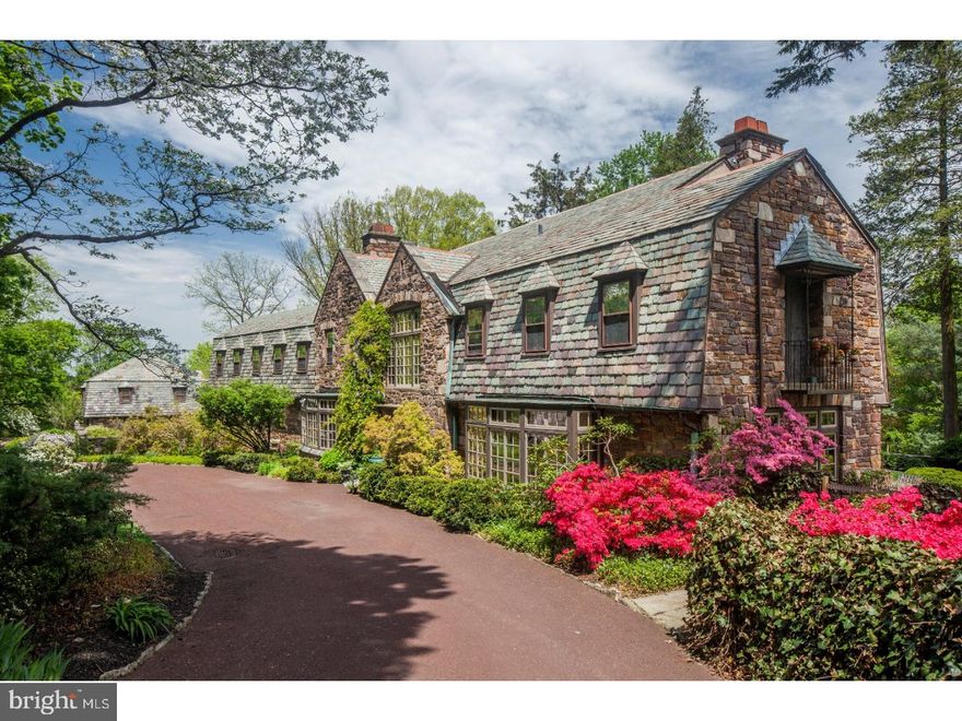 Beautiful Dutch-style stone Chestnut Hill estate adjacent to Morris Arboretum. Built for entertaining and gracious everyday living, this home is nestled on a large, private lot amongst mature plantings and gardens.  An inviting drive leads to the lovely front entrance. Large center hall with grand staircase opens to the spacious loggia with original stone checkered floor, wood stove fireplace and multiple doors to the peaceful rear terraces. Large living room with original built-ins, carved stone fireplace, beautiful bay window nook and access to the rear terrace. Large dining room with bay window, original curved corner cabinetry and adjoining butler's pantry. Cozy kitchen with large center island and access to the rear deck overlooking the lush grounds. A rear entrance with laundry also doubles as a gardening/workroom and offers access to the private, walled courtyard. Large master bedroom with updated ensuite bath and lovely Juliet balcony. Two bedrooms with a jack and jill bath and a second bedroom suite with bath. Large, second floor in-law suite with bath, bedroom, kitchenette and den with private rear access. Spacious detached carriage house is perfect as a nanny or in-law suite, and offers a living room, bedroom, kitchen and full bath. The grounds are resplendent with multiple terraces, in-ground pool, walled courtyard, gorgeous plantings and mature trees. Conveniently located close to local shops and restaurants, this one-of-a-kind Chestnut Hill estate is not to be missed!