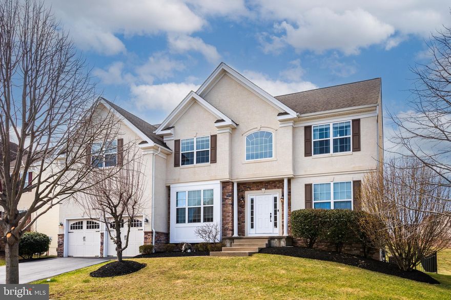 Welcome to 4127 Crescent Dr, a stunning 4-bedroom, 2.5-bath residence located in the desirable Byers Station community of Chester Springs. This home features fresh paint, brand new carpet, and hardwood flooring that flows seamlessly throughout the main level. As you enter the home, you’re greeted by a sun-filled foyer with soaring cathedral ceilings, creating a bright and inviting first impression. To the right is a formal living room, while the dining room sits to the left—ideal for hosting gatherings. Beyond the foyer, the layout opens into a spacious and airy family room highlighted by a gas fireplace and dramatic ceiling height. A private office and convenient powder room are tucked just off the family room, offering a perfect setup for remote work or quiet study. The space transitions effortlessly into the expansive kitchen, complete with granite countertops, stainless steel appliances, and an oversized island with ample seating. Adjacent to the kitchen, the casual dining area provides access to a rear deck overlooking the fenced yard—perfect for entertaining or enjoying outdoor living. A mudroom and laundry area complete this level.
Upstairs, the generously sized primary suite offers four custom walk-in closets and an  en-suite bath featuring a soaking tub, walk-in shower, dual vanities with extended counter space, and a private water closet. Three additional bedrooms and a full hall bath complete the upper level. The finished basement is an entertainer’s dream, offering versatile space that can accommodate a game room, fitness area, media lounge, or all of the above. Residents of Byers Station enjoy many amenities, including walking trails, basketball and tennis courts, playgrounds, a clubhouse, and an outdoor pool. Don’t miss your opportunity to make this exceptional home your own!