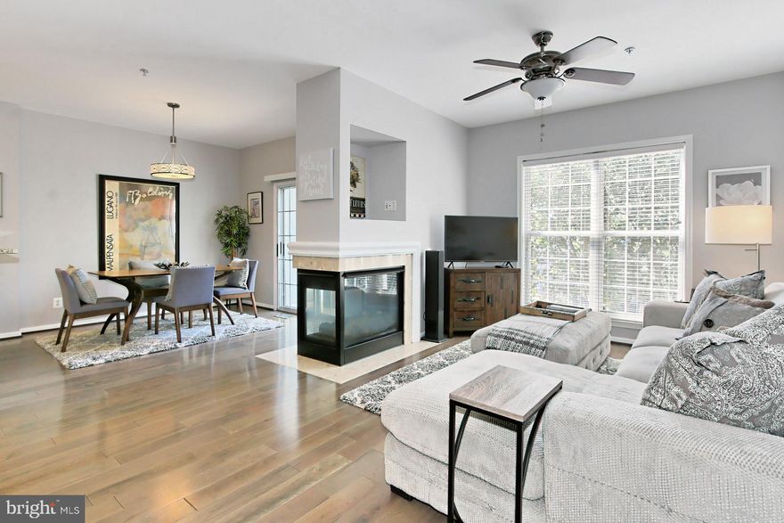 Welcome home!  This spectacular 3 level townhouse condo is in  PRISTINE CONDITION! This home is located on a QUIET CUL DE  SAC with VERY LITTLE CAR OR FOOT TRAFFIC!  This home has many  UPGRADES and DESIGNER FEATURES!  NEW WOOD FLOORS INSTALLED IN 2020. NEW CARPET INSTALLED IN 2019. The large tiled hall/foyer leads to a VERY OPEN living area that includes a living room and dining room separated by a THREE SIDED GAS FIREPLACE!  The large eat-in kitchen features  STAINLESS STEEL APPLIANCES, GRANITE COUNTER TOPS WITH BREAKFAST BAR, A CUSTOM  WINE CABINET AND A PANTRY.  A PRIVATE BALCONY is located just off the dining room for your enjoyment. The large primary bedroom features A JETTED TUB, A SEPARATE SHOWER AND A LARGE WALK IN CLOSET. The large second bedroom also has a PRIVATE EN-SUITE FULL BATH! A separate laundry room and an EXTENDED LENGTH GARAGE is located on the main level. This home is located in the much sought after OVERLOOK COMMUNITY! Conveniently located near I395, I495 & I95 for an EASY COMMUTE.  It is a FIVE MINUTE DRIVE to the VAN DORN METRO STATION. METRO BUS stops are located close by on EDSALL ROAD.