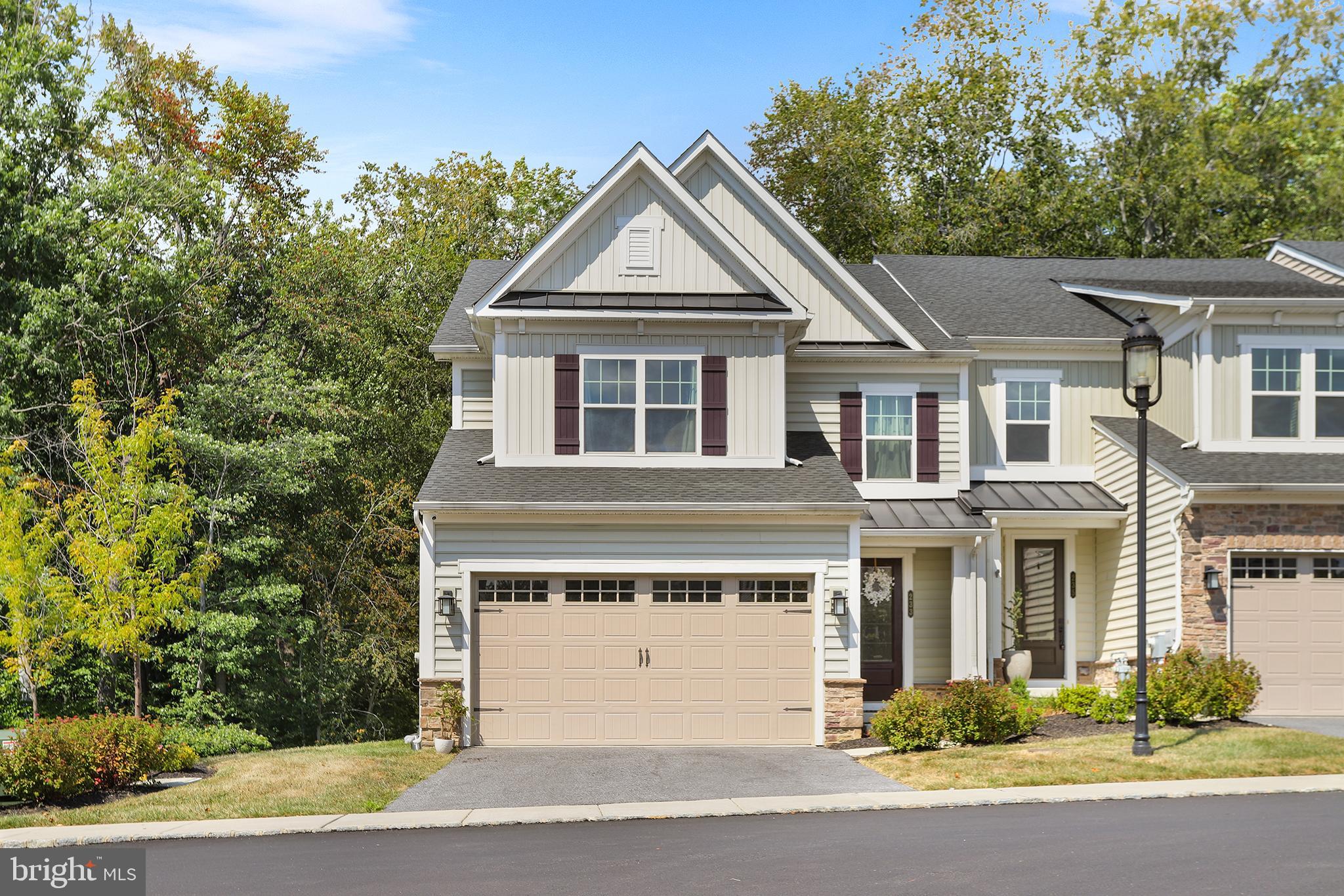 Welcome to Ponds Edge! Built in 2022, this 4 bedroom, 3.5 bath end-unit townhome in the award-winning Rose Tree Media School District offers modern living with style and convenience. As an end unit, you’ll enjoy extra natural light, added privacy, and serene wooded views from the rear deck and walkout basement. Inside, hardwoods flow throughout the open floor plan. The gourmet kitchen features quartz countertops, stainless steel appliances, and an oversized island—perfect for everyday living or entertaining. The spacious family room is anchored by a gas fireplace, while the dining area provides room for gatherings. Upstairs, retreat to the primary suite with a walk-in closet and a spa-like en suite bath, complete with a designer tiled shower and dual vanity. Three additional bedrooms, a full hall bath, and a convenient laundry room complete the upper level. The finished walkout basement adds valuable living space with a full bath, ideal for a media room, gym, or play area. Enjoy community amenities including a clubhouse and fitness center, plus the unbeatable location—close to Media Borough restaurants, shopping, and Septa’s Wawa Station for easy access to Center City. This move-in ready home combines luxury, privacy, and convenience in one of Delaware County’s most sought-after communities.