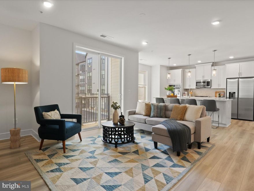 Welcome to vibrant Birchwood at Brambleton, an award-winning Active Adult (55+) community! This stunning 2nd-floor condo, located in a secure building with attached garage, is ready to be your private oasis. The open floor plan is filled with natural light and features wide-plank luxury vinyl floors throughout.  New appliances include SS fridge & dishwasher, cloths washer & dryer. Enjoy mother nature from your private balcony.  A chef-inspired gourmet kitchen with quartz countertops, a large island, and modern finishes is perfect for entertaining guests. The spacious primary suite includes two walk-in closets and a beautifully upgraded bath, while the spacious secondary bedroom also offers its own walk-in closet and stylish full bath.  This residence includes a convenient 1-car garage.  Birchwood at Brambleton offers low-maintenance living with HOA fees that include Verizon Fios TV & internet, water, snow removal, and trash. Residents enjoy a 20,000 sq. ft. Clubhouse with indoor/outdoor pools, fitness center, golf simulator, demo kitchen, and spaces for social gatherings. Outdoor amenities abound with pickleball and bocce courts, walking trails, gardens, a fishing pier, tot lots, and easy access to the Stream Valley Trail. All just minutes from Brambleton Town Center, Loudoun County wineries and breweries, Metro’s Silver Line, Dulles Airport, and top healthcare centers—this community beautifully blends comfort, convenience, and an active lifestyle.