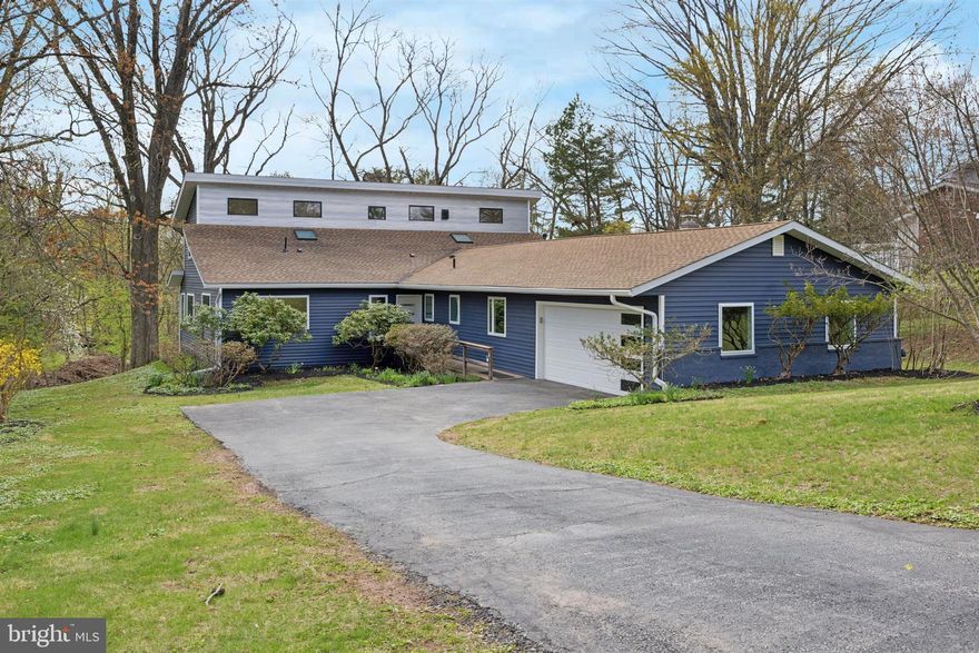 Welcome to a one-of-a-kind residence where sleek design meets serene surroundings. This thoughtfully reimagined fully remodeled home offers modern luxury and functionality in every square inch—all set against the breathtaking backdrop of the Pickering Creek Reservoir.
From the moment you enter, you're drawn towards a wall of windows on the main level that floods the space with natural light and frames peaceful water & wooded views. The open layout has been artfully redesigned to suit today’s discerning buyer, blending a clean, contemporary aesthetic with everyday practicality.

The show-stopping kitchen is a true centerpiece—featuring a large center island with waterfall edges, custom cabinetry, and high-end finishes. Thoughtful touches include: outlets under the cabinets in the kitchen and island bar overhang and under-shelf outlets at the wet bar. There’s also an outlet tucked inside the pantry cabinet to the left of the range—perfectly placed for a microwave or small appliance setup.

The dining area, conveniently located just off the kitchen, features a wet bar, conducive for entertaining. The spacious living room offers flexibility to create a layout tailored to your lifestyle, all while taking in serene, picturesque views.

The main level includes a bedroom with an en-suite bath—ideal for use as an au pair suite, guest room, in-law space, or even a private haven for a teenager. Two additional generously sized bedrooms and a fully updated hall bath complete this section of the home. Need more flexibility? A spacious bonus room just off the main living area can easily serve as a home office, playroom, or even an extra bedroom. Oversized laundry and a powder room round out the main level.

A beautifully crafted wooden staircase leads you upstairs to the primary retreat—a true sanctuary featuring dramatic vaulted ceilings, reservoir views, and a luxurious en-suite bath with dual vanities and dual shower heads. An additional room on this floor expands the possibilities, well suited for a nursery, yoga space, reading nook, or secondary office.

Other highlights include a 2-car garage, an unfinished basement ready for your vision, and a beautifully landscaped yard. Enjoy evenings by the firepit, surrounded by nature, with the tranquil sounds of a nearby brook and reservoir completing the scene.

On the opposite side of the reservoir is Sedgley Farm—one of the largest remaining open spaces in Schuylkill Township—and recently secured for permanent preservation. This conservation effort aims to protect its historic significance, conserve the environment, and create future open space and recreational opportunities—which over time could add even greater enjoyment to the surrounding community.

This home is not just a renovation—it’s a transformation. Come experience the perfect fusion of peaceful location, modern layout, and designer details—complete with brand new HVAC, water heater, and appliances for total peace of mind.