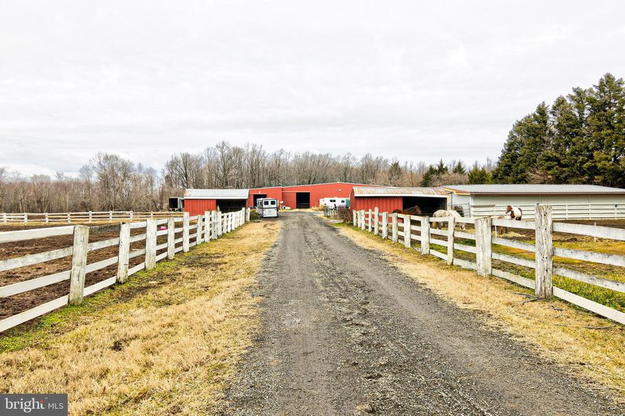 EQUESTRIAN PROPERTY on just over 10 acres in Davidsonville. The all brick house is a 4 bedroom, 2.5 bath one level contemporary home with over 3500 sq. ft. of indoor living. . . . . . . . . . . .  This property has two barns, 6 fenced in fields and an auto generator which services both barns. , . . . . . . . . . . . . . . . The 4 bedroom, 2.5 bath home has open rooms with cathedral ceilings and a lot of natural light, a screened in porch, dual sided stone fireplace, attached garage, 18 x 36 inground pool with new liner and granite pool deck. New HVAC installed in 2019.