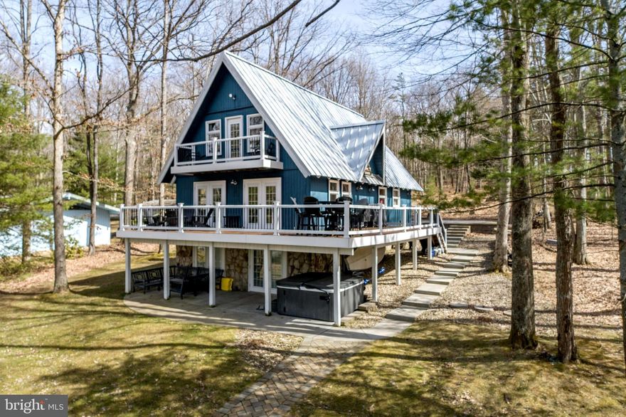 Lakefront chalet home in a peaceful cove with sunset views!  This 5 bedroom 3 bath, 2 fireplace lakefront retreat has been updated and offers plenty of indoor and outdoor living spaces.   Located on the non commercial southern end of the lake and within a few hundred yards of the incredible Thousand Acres Golf Course, now  with 18 holes.  Perfect for all water activities including sailing and kayaking.   Includes dock, storage buildings etc.

DISCLOSURE:  RAILEY REALTY IS NOT THE CARETAKER OF PROPERTIES LISTED BY IT.   DURING INCLEMENT WEATHER CONDITIONS, PROSPECTIVE PURCHASERS AND THEIR AGENTS ASSUME ALL LIABILITY ASSOCIATED WITH OR BY WEATHER AT THE PROPERTY.