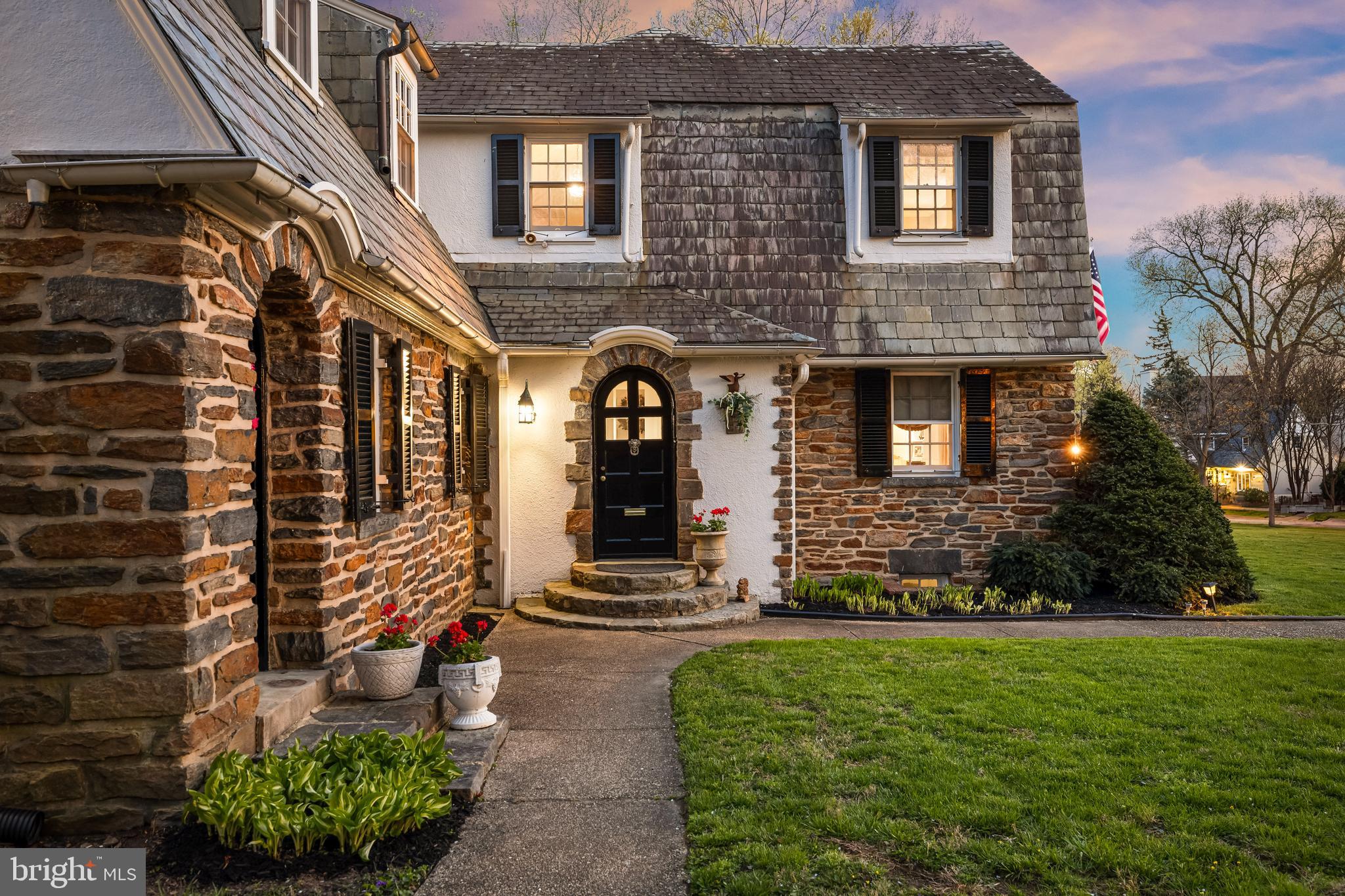 Iconic Guilford home on a ½-acre double lot, once owned by T. Rowe Price and available for the first time in over four decades.
Located in one of Baltimore’s most celebrated historic neighborhoods, this home is a true standout. Its charming English cottage exterior—crafted of stone, stucco, and slate—opens to a rich interior filled with character: textured plaster walls, arched doorways, sun-drenched rooms, and dramatic wormwood chestnut-beamed ceilings. Timeless and welcoming, it offers a unique blend of old-world charm and modern comfort.
On the main level, you'll immediately be embraced by the warmth of historic charm. A stunning formal living room or lounge, framed by dramatic chestnut beams, features a gorgeous plaster wood-burning fireplace. French doors open to a serene rear patio—perfect for relaxing with a cocktail or entertaining guests. The formal dining room, complete with its own fireplace, is cozy yet refined, ideal for intimate dinner parties. The kitchen has been updated with timeless finishes including neutral cabinetry, quartz countertops, stainless steel appliances, a gas range, and picturesque backyard views. A breakfast nook with original built-in cabinetry and an antique servant’s bell adds character and a nod back to yesteryears. While the home offers several elegant formal spaces, it also includes a comfortable family room where you can unwind with loved ones. And finally, the classic Guilford sunroom with terracotta floors, wraparound windows, French doors leading to the backyard, and a full bathroom—offers incredible versatility and could even be a main level bedroom.
Upstairs, 4 unique bedrooms and two full baths await. The dramatic primary suite boasts chestnut-beamed ceilings, terracotta floors, a Colonial-style brick fireplace, updated en-suite bath, and a private hall of closets. The 2nd and 3rd bedrooms feature original wood floors, and one includes a Juliet balcony with arched window. The 4th bedroom offers flexibility as a guest room, nursery, office, or large walk-in closet. An updated center-hall bathroom serves the secondary bedrooms. The unfinished basement offers generous storage and potential for future expansion.
Outside, the home sits on an incredibly rare and private 0.56-acre double lot with flowering trees, a 15-foot stone wall, and white picket fencing. A flagstone patio runs along the rear of the home beneath a pergola draped in wisteria, perfect for outdoor entertaining. The 12x26 Amish-built shed is wired for electricity and offers space for a car, studio, or workshop—easily convertible to an indoor-outdoor retreat. Whether you envision a pool, tennis court, putting green, or wide-open play space, this lot offers limitless opportunity.
The home has been updated while preserving its historic integrity including a new copper water line, updated interior plumbing, new hot water heater, gas boiler (2016), upgraded electrical, sump pump, Drylok-treated basement, certified asbestos removal, three-zone A/C (2018), well-maintained roof and siding, and newer Pella windows in parts of the home.
Ideally located in the heart of Guilford, just two blocks from Sherwood Gardens and Reservoir Park, the home is also a 3 minute drive to Calvert School and minutes to restaurants, shopping, museums, Johns Hopkins University, Loyola, and Union Memorial. Guilford is a true “Goldilocks” neighborhood—Here, you can enjoy a sizable, detached home with a yard without sacrificing the social amenities found only in the city. With sidewalks, streetlights, and multiple parks, it's a highly walkable and welcoming community. The neighborhood HOA hosts numerous events throughout the year, including house tours, children's events, outdoor movie nights, and cocktail parties—offering you the freedom to be as social or as private as you wish.
Don’t miss this rare opportunity to own a one-of-a-kind English cottage on a spectacular double lot in historic Guilford.