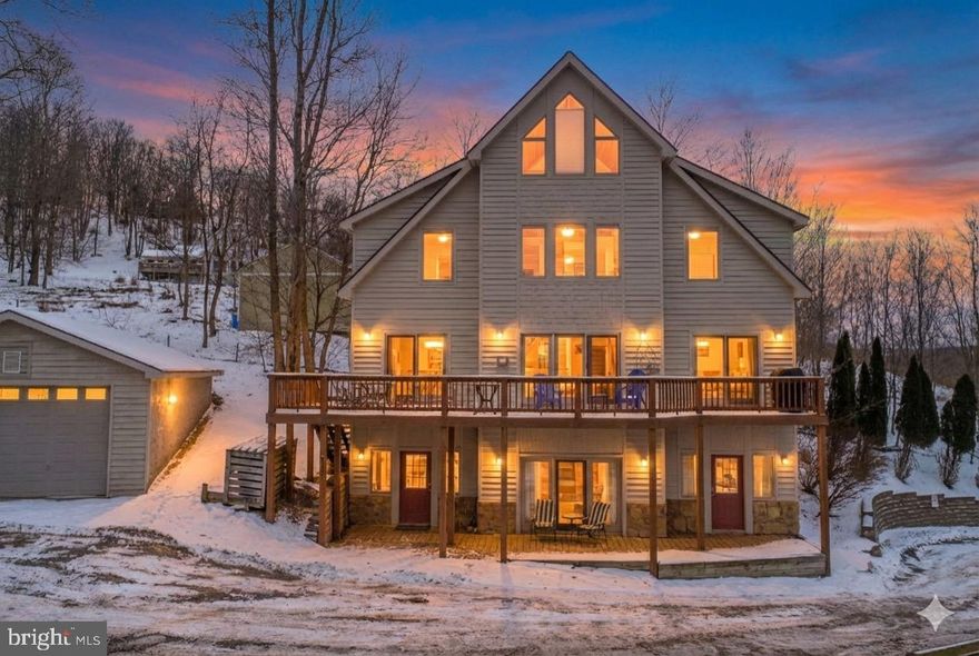 Welcome to this 4-bedroom, 4.5-bath stand-alone, multi-level unit in Traders Landing!  Offering filtered lake views, ample square footage, oversized bedrooms, and multiple living spaces, this property is ideal for entertaining, large groups, or relaxed mountain-lake living. Enjoy a central Deep Creek location just minutes from Deep Creek Lake, local restaurants, shopping, and Wisp Resort. Privately managed and successfully rented through Airbnb, the home offers excellent rental potential. Privately owned dock slips across the street provide the option to join a wait-listed dock program, adding even more appeal. A well-rounded opportunity for a second home, investment property, or full-time residence at Deep Creek Lake!