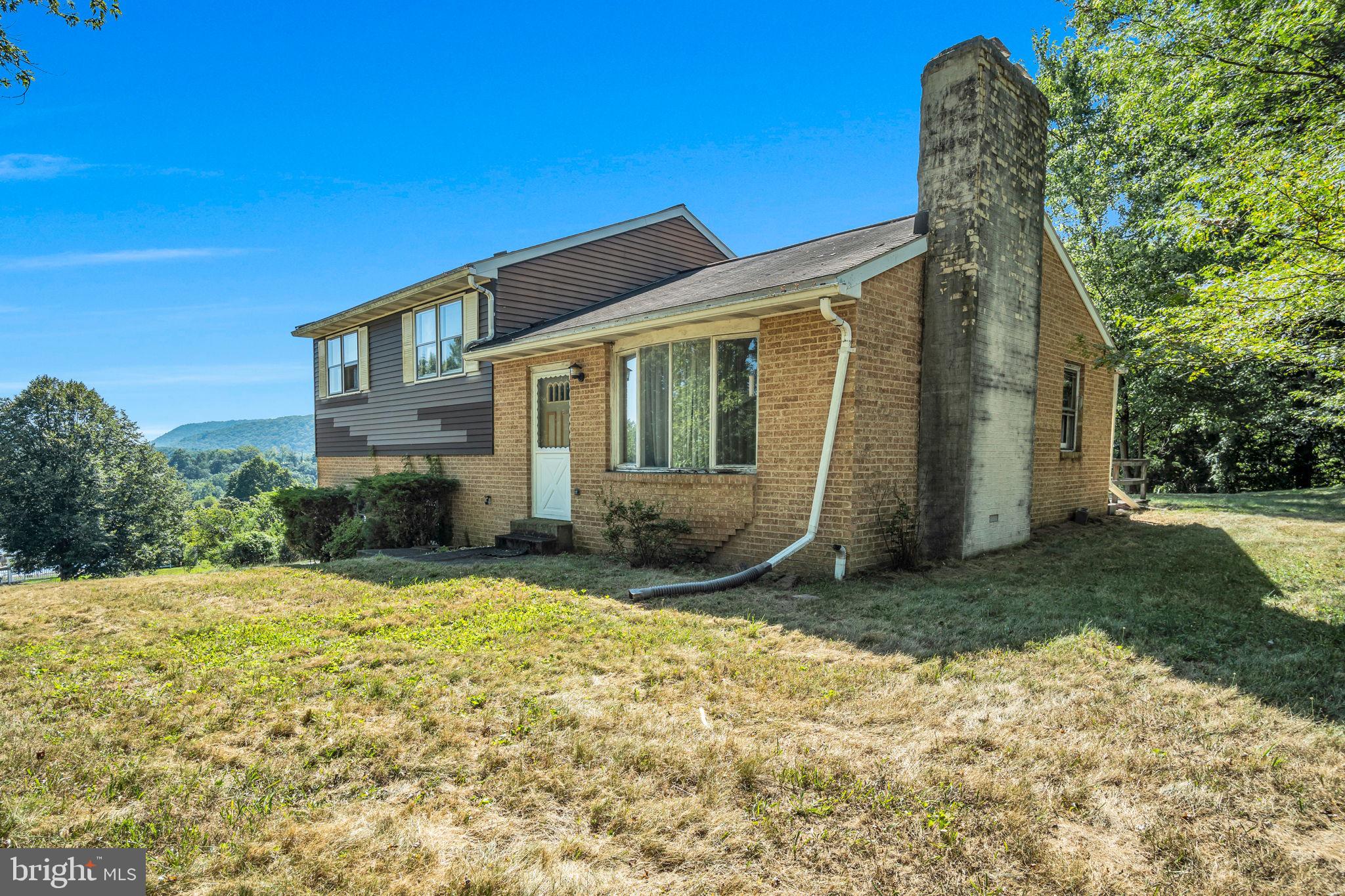OFFER DEADLINE FRIDAY AUG 22 @ 11AM.
Step back in time — and into opportunity!
This diamond in the rough is ready for its next chapter. Straight out of the 70’s, you’ll find vintage green carpet, colorful wall paper, solid bones, and a beautiful lot of over 2 acres that will make you want to roll up your sleeves. Featuring 3 bedrooms, 2 full baths, a kitchen, and a living room with a cozy wood-burning fireplace, plus a lower-level unfinished basement with an additional fireplace—though who knows the last time either was used? (Property is being sold as-is.)
The attached 2-car garage adds convenience, and the expansive acreage offers room to roam, garden, or just relax. Yes, it needs some love—but with serious sweat equity potential, this is your chance to turn retro into remarkable!