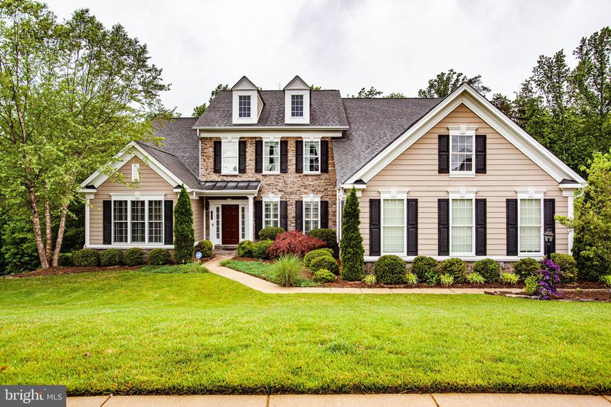 An absolutely stunning home in The Estates of Idlewild. Over 6,600 finished square feet over three levels. The builder spared no expense as this custom home boasts with amazing upgrades throughout. The elegant two-story foyer sets the stage for this home as you enter. Prodigious  first floor master bedroom, master sitting room, and master bathroom. Great open concept floor plan with the kitchen overlooking the massive two-story family room.  Gourmet kitchen with GE Profile SS appliances, including a built-in coffee maker, warmer drawer, wall microwave/oven combo, wine cooler, and a gas cooktop with SS range hood. Hardwood and ceramic throughout the first floor. Beautiful moldings, tray ceilings, and two story features throughout. Huge Composite deck off of the first floor that leads down to a screened in porch with  beautiful brick hardscape. The basement offers a huge wet bar, amazing theatre room, home gym, full bathroom, storage, and a huge rec room with walkout access to the screened in porch. Concrete driveway leads to a side-load three car garage. Great location that is easily accessible from Route 3 and Route 1 for amazing convenience to downtown Fredericksburg and I-95.