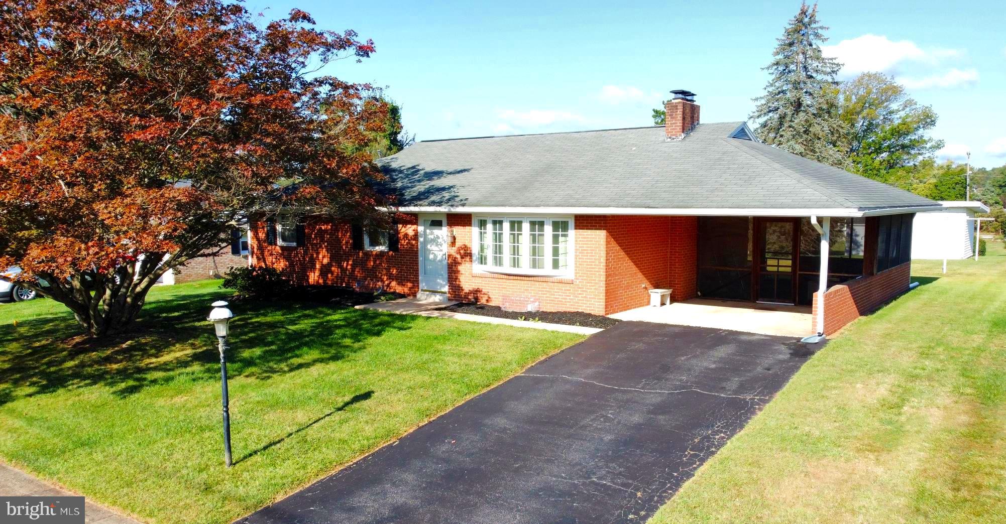 New to the market! Solid brick Rancher in quiet and convenient location. This 3 bedroom 1.5 bath home has been well maintained and features updated HVAC and replacement windows. The main level boasts hardwood flooring and a large eat-in kitchen. A cozy screened porch overlooks the large, level backyard. The lower level has a stairwell to the backyard and includes a finished family room with wood burning fireplace. Recent upgrades include a basement water proofing system and family room vinyl flooring. This home is USDA eligible for 100% financing and would make a fantastic starter home with affordable annual taxes. Mt Wolf is a well established neighborhood with easy access to I-83 and walking distance to schools and parks. Call today to schedule a private tour and call this place home !