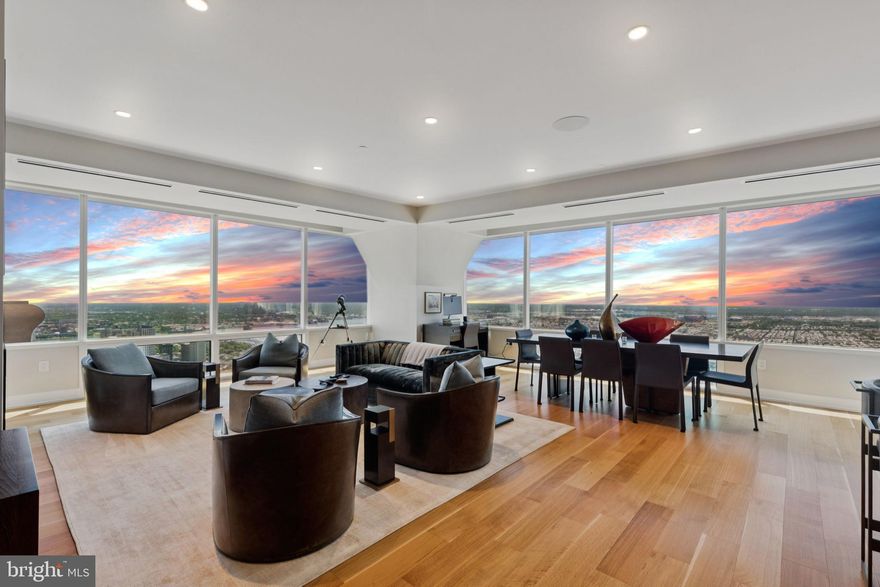 PENTHOUSE PERFECTION IN THE SKY — Welcome to an extraordinary three bedroom, three and a half bath penthouse residence soaring 55 stories above the city. Offering over 2,300 square feet of refined living space, this stunning home captures sweeping sunrise, river, and skyline views through walls of architectural windows that bathe the interiors in natural light. The expansive living and dining areas are framed by soaring ceilings and gleaming hardwood floors, creating a remarkable backdrop for everyday living and entertaining. The chef’s kitchen is appointed with marble countertops, sleek SNAIDERO cabinetry, and premium SUB-ZERO and MIELE appliances, a perfect blend of form and function.The primary bedroom suite is a serene retreat, showcasing picture-perfect vistas and a large, custom walk-in closet. The spa-inspired primary bathroom features double floating vanities, an oversized soaking tub, and a spacious glass-enclosed shower. The second and third bedrooms are generously sized, each with ample closet space and en-suite baths, offering comfort and privacy for family or guests. A pristine, meticulously maintained residence with designer finishes throughout, this is penthouse living redefined at the iconic Two Liberty Place.