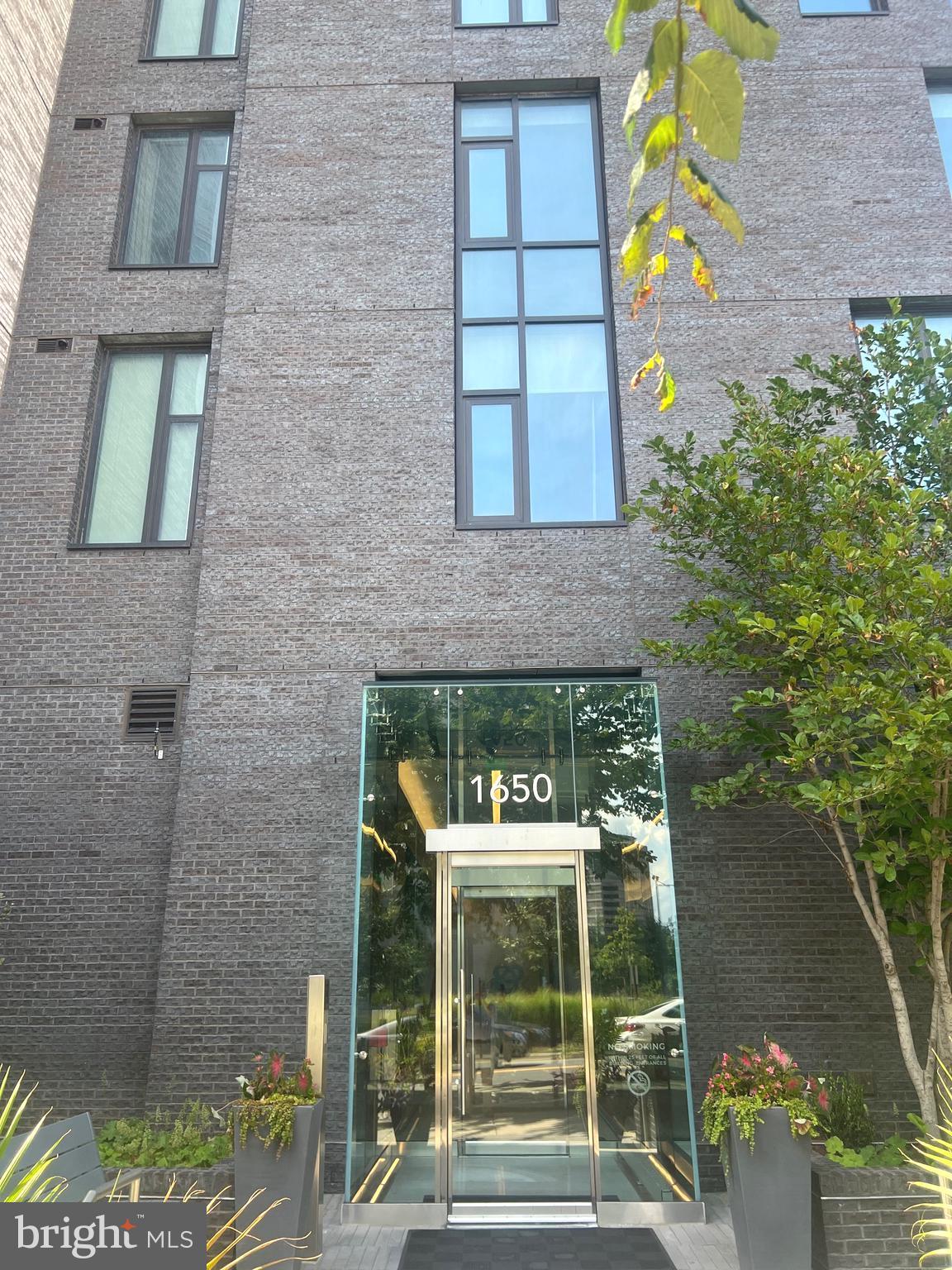 Luxury Condo in Tysons - built in 2019 - in the heart of The Boro community. The Boro is Tyson's dynamic new walkable community. Beautiful Furniture. It could also be rented without furniture. The Verse won the “Best Washington/Baltimore Condominium Community” at the 24th Annual Delta Associates’ Market Overview & Awards for Excellence. Verse is the pinnacle of sophisticated luxury. With architecture by the award-winning firm of Shalom Barnes and signature kitchens by Cecconi Simone, Verse has cultivated its living environments to be 25 stories above the rest. Enjoy 5-star luxury amenities such as 24-hour concierge, fitness center with a yoga studio, swimming pool, elegant lobby, grand entertainment lounge, guest suites and a world-class 1-acre skypark. Just a few steps outside Verse, residents will find the Flagship Whole Foods Market, Greensboro Metro station on the Silver Line, and all the exceptional shopping and delicious dining that Tysons has to offer. Every comfort and convenience—inside and out. Chef-caliber appliances integrated into Italian cabinetry, composite stone countertops, floor-to-ceiling windows, and spa-inspired baths all unite to create a private refuge for homeowners searching for tranquility without compromising walkable convenience. Enjoy your large one bedroom with balcony floor plan. Large pantry and island. Balcony w/stunning views! Large closets. Building has 24 hour concierge, fitness studio, yoga room, guest suite, sky park!