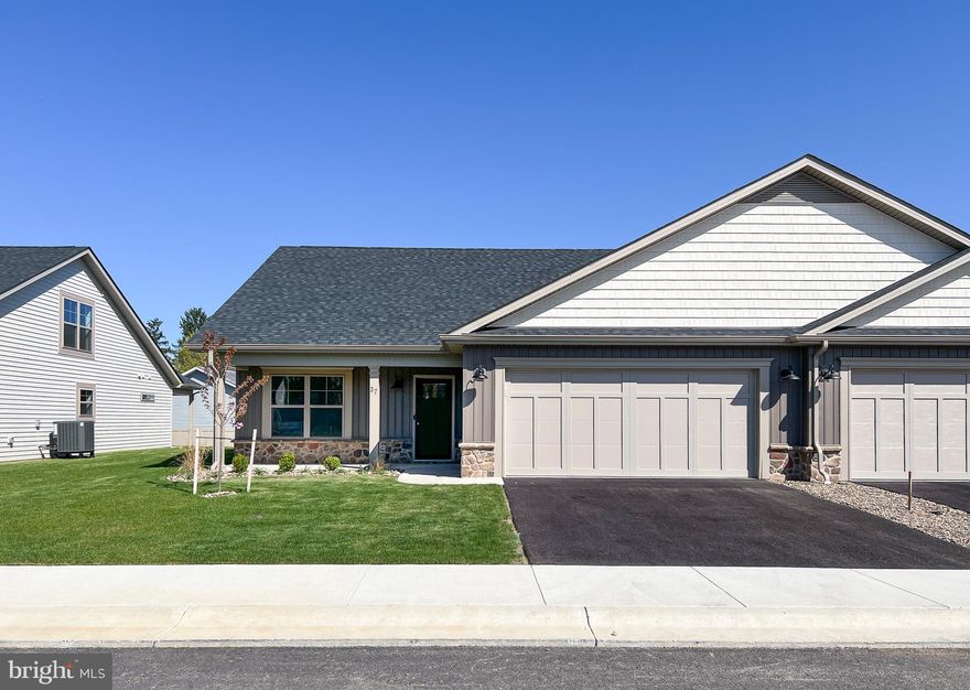 Construction of this home is complete!  Pictures are of the actual home and finishes.  Welcome to The Villas at Warm Springs - Berkeley County's newest 55+ Community.  This quaint community is made up of only 14 Villa homes and offers a peaceful setting with sidewalks throughout.  It is conveniently located close to shopping, restaurants, medical facilities and has easy interstate access.  Mowing of your lawn, curbside trash pickup, road maintenance and snow removal of your driveway, sidewalks and the roads are all included as part of your HOA dues!  All villas come standard with a beautiful ceramic tile zero barrier Owner’s Shower, matte black lever door handles and fixtures, architectural grab bars in the Owner’s Suite bathroom and quartz or granite countertops throughout the kitchen and bathrooms.  Enjoy the ease of mobility with 36" doorways, no step thresholds and LVP throughout the main level.  A large laundry room with a sink is located immediately outside of the Owners Suite bedroom. These features provide low maintenance living so you can enjoy accessibility throughout your new home.  The yard has been finished with lush sod, river rock landscaping and low maintenance shrubs.   Construction in the neighborhood is nearing completion.  Several homeowners are already enjoying their new homes in The Villas at Warm Springs, stop by and see if this home would be the right move for you!