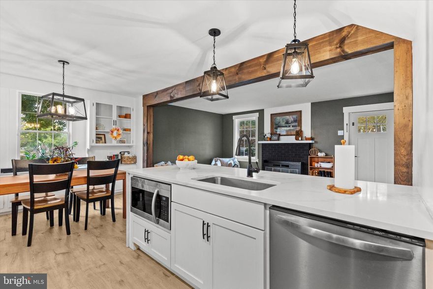 Welcome to 814 Rex Avenue, a beautifully renovated 4-bedroom, 2-bathroom home nestled in the desirable Cornwall-Lebanon School District. This residence combines timeless charm with modern sophistication, offering a seamless blend of comfort, craftsmanship, and contemporary design.

Step inside to discover gorgeous hardwood floors, exposed wood beams, and a cozy working fireplace that anchors the main living area. The gourmet kitchen is a true showpiece, featuring striking quartz countertops with a dramatic waterfall edge, sleek cabinetry, and a natural gas stove—the perfect setup for home chefs and entertainers alike.

The thoughtful layout includes a main-level bedroom, ideal as a guest suite, in-law space, or private office. Upstairs, you’ll find three additional spacious bedrooms, each with new flooring, fresh paint, and updated windows, ensuring comfort and style in every corner.
Enjoy the convenience of a first-floor laundry room and a fully upgraded natural gas HVAC system for efficient, year-round comfort.
Outside, the restored side porch invites you to relax with your morning coffee or unwind with a good book. At the same time, the rear sunroom offers an expansive space for gatherings or for peaceful afternoons filled with natural light.
This home truly offers modern luxury within a classic frame—move-in ready and meticulously updated from top to bottom.