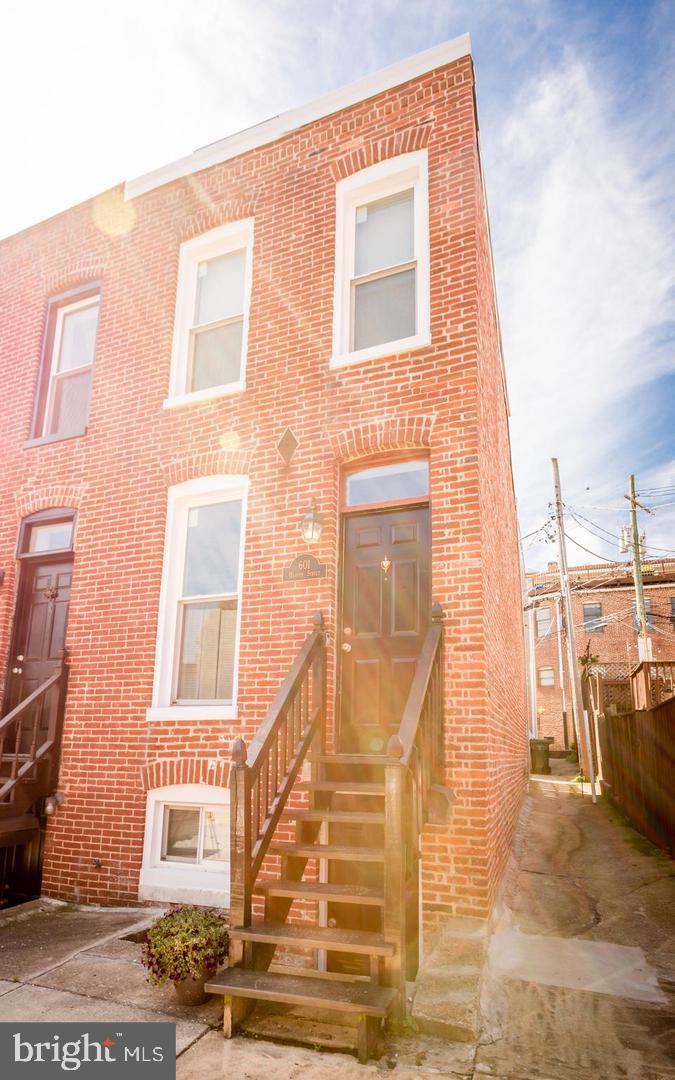 This cute 2 bedroom 2 bath End Of Group Rowhome located in Federal Hill has a little bit of everything you're looking for. The large rooftop deck is a great place to entertain and relax, it offers the best views that Fed Hill has to offer from the community to the Inner Harbor. The moment you walk in you are welcomed with (original) gleaming hardwood floors (on the first level and upstairs) you'll feel the charm that this home has to offer. The granite countertops and stainless steel appliances are beautiful as well and to top it off, the basement is finished for extra living space as a rec room or third bedroom, and full bath. Fenced in yard. Close to shopping, dining, pubs, and much more!