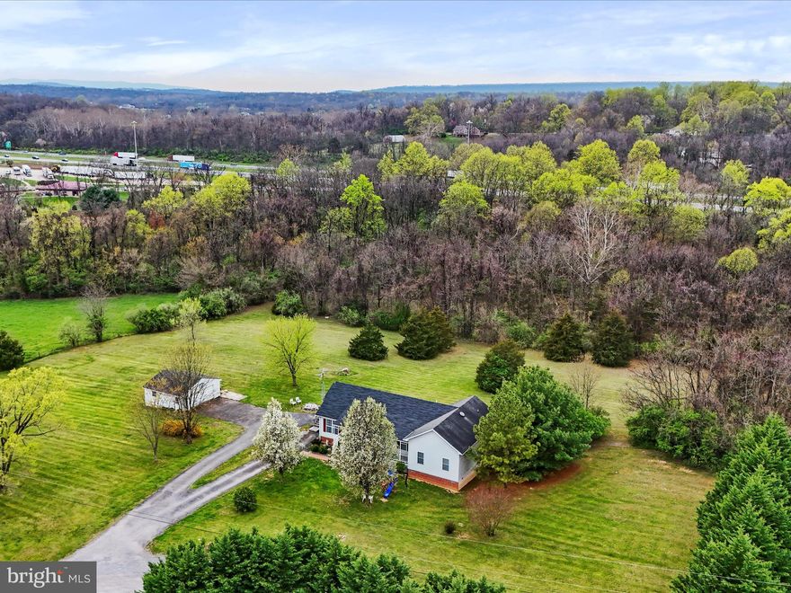 Nestled on just over 5 acres this home offers both space and comfort in a friendly neighborhood setting. Featuring 4 spacious bedrooms and 4 full bathrooms, and a finished basement. The heart of the home is accentuated by large bedrooms that promise restful nights and versatile living spaces. The primary bathroom includes a spa-like setting for relaxation and rejuvenation. The finished basement adds a generous extension of space, perfect for entertainment, a home gym, or additional family living area.  Outside, the property offers expansive green spaces and an above-ground pool, providing an ideal backdrop for outdoor entertaining and leisure. The 2-car detached garage offers ample space for vehicles and storage, ensuring practicality matches the elegance of the home.  This property does not just offer a house but a lifestyle, ideal for those seeking privacy and space in a warm and welcoming community. Make this  your forever home and enjoy the blend of comfort, style, and tranquility it offers.