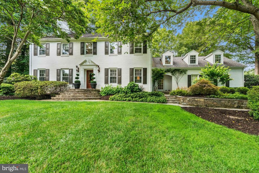 Beautiful colonial handsomely sited on lushly landscaped private lot just blocks to the Potomac *  Offering 6,700 sf of elegant living with flowing floor plan perfect for entertaining * Incredible great room w/built-ins, high ceiling, stone fireplace and wall of windows & glass doors to flagstone patio  * Master suite w/ sitting room & door to an expansive upper terrace offering spectacular views