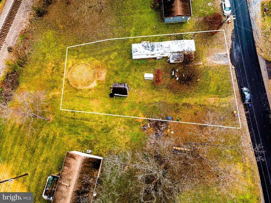 Three lots for one price. You can build 2 homes or 2 duplexes. Great location for new construction. Trailer conveys with the property. You can live in the trailer while you build your dream home. There are so many possibilities. 3 bedroom 1.5 bathroom. Shed on property. Amazing price for the opportunities this property offers.