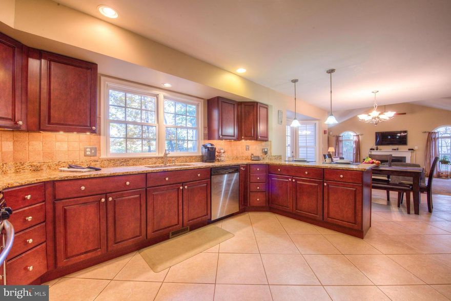 Don't miss this beautiful home! Character throughout including: hardwood floors, high ceilings & vaulted ceilings. Upgrades include SS oven and dishwasher, breakfast bar, custom lighting in master bath, soaking tub and separate shower. Entertain in your finished basement with recess lighting or on your deck surrounded by trees.