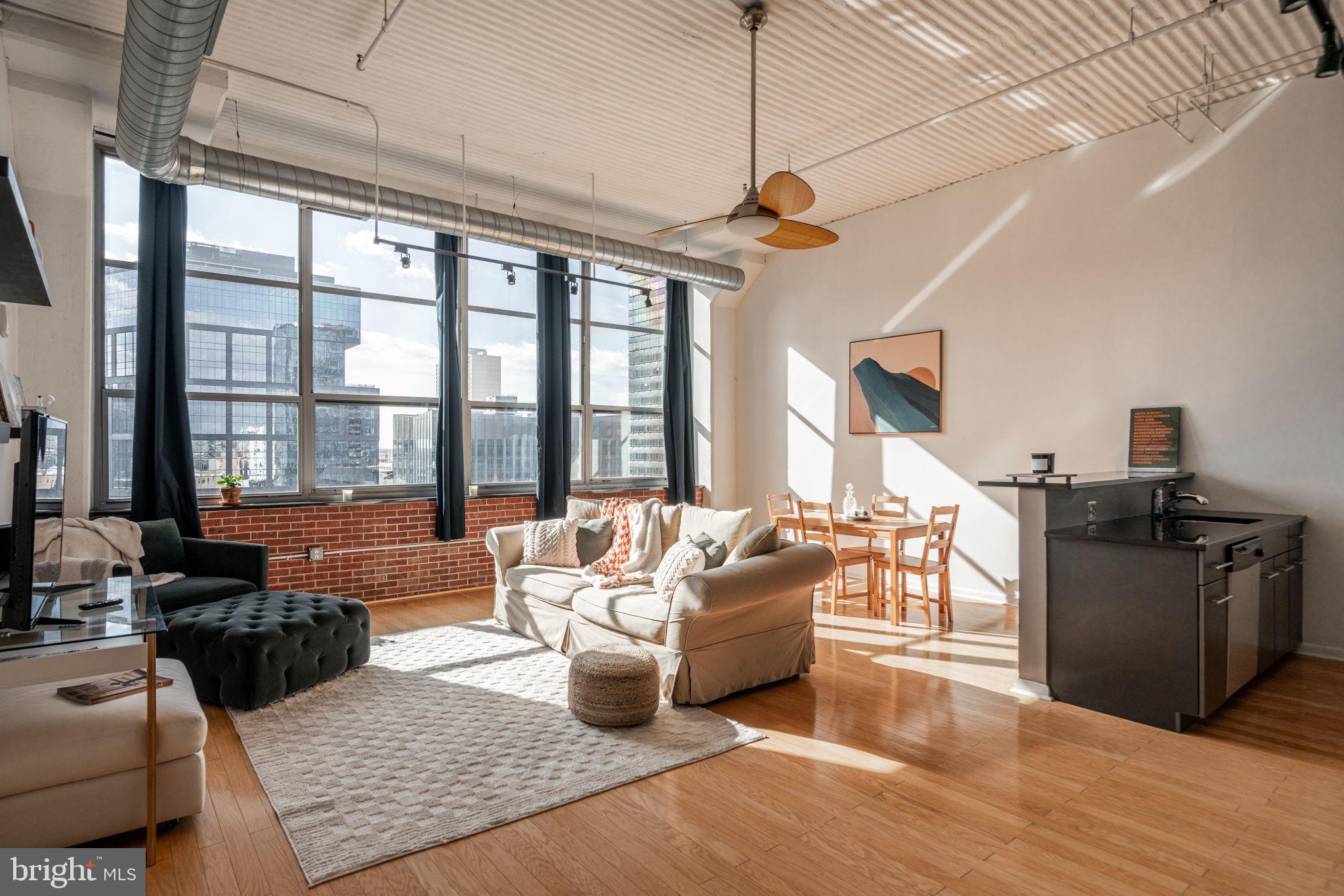 Incredible Value !! Welcome to The Larkin! The beautiful 176 Unit historical building in Logan Square. Formerly the site for the Philadelphia Daily News, this chic New York Style loft building blends the look of industrial commerce with modern contemporary design. The South facing unit has wonderful unobstructed views of the Center City skyline. 1000 sqft of Open concept living and dining, gets abundant light from its massive windows. A true fully enclosed 1 Bedroom space, ample closet space. Modern kitchen and bathroom finishes with a tasteful color palate to contrast the light hardwood flooring throughout. Washer dryer in unit. Exceptional Amenities - - 24hr doorman front desk, lobby and smooth elevator, large gym fully equipped. Deeded Parking space in attached garage - direct access into the building. Coffee and groceries at your convenience - Starbucks, Trader Joes, Giant foods. Quick walk to Market Chestnut and Rittenhouse shopping. Schuylkill River trail to exercise and picnic. Museums and sites up and down the parkway. Easy Access to I-76 / 676 as well as 30th street station. The Larkin in Logan Square - a perfect mix of convenience and culture for city living.