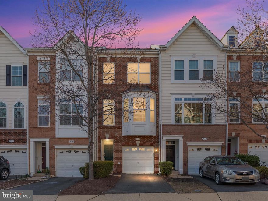 Welcome to 20415 Trails End Terrace, a charming 1,732-square-foot townhouse nestled in the sought-after Belmont community of Ashburn, Virginia. This inviting residence, built in 2005, and freshly painted, features two spacious bedrooms and two and a half bathrooms, offering a comfortable and modern living space.
As you step inside, you’ll be greeted by gleaming hardwood floors that flow seamlessly throughout the main level. The gorgeous kitchen, boasting granite countertops, newer stainless steel appliances, and a cozy breakfast area—perfect for morning coffee or casual dining. Adjacent to the kitchen is a separate dining room, ideal for hosting family dinners or entertaining guests.
Upstairs, you’ll find two generously sized primary suites, each equipped with its own private bathroom, providing comfort and privacy. The lower level offers a walk-out basement leading to a partially enclosed yard—a versatile space that can serve as a family room, home office, or recreational area.
Outdoor living is equally delightful, with a cozy recently painted deck perfect for relaxing or entertaining. Additional conveniences include a one-car garage and driveway space for an extra vehicle.
Located in the vibrant Belmont community, this townhouse offers easy access to local amenities, shopping centers, and dining options, making it an ideal place to call home.
Don’t miss the opportunity to own this beautiful townhouse that combines comfort, style, and convenience in one of Ashburn’s most desirable neighborhoods.