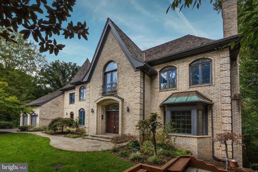 Enchanting all brick entertainer's dream with views overlooking the Cabin John Creek.  Five wood burning fireplaces, Formal Living room with a fireplace, Formal Dining Room, Grand Entrance foyer with curved staircase.  Great Room with wet bar and floor to ceiling fireplace plus Gleaming hardwood floors. Extra Large kitchen with breakfast room plus adjoining sunroom, & double islands and walk-in pantry.  Main floor office plus two half baths one for your guests and one for staff.  The second floor has an expansive master suite with fireplace in sitting room, separate seating area, two large walk-in closets, dressing area and large main bath.  There is a second smaller suite and two additional bedrooms with a Jack and Jill bath between.  The surprising lower level has a sunken living room with fireplace and separate entrance on the side of the house.  There is also a bedroom and full bath, with tub and sauna on this level plus storage.   The are many levels of decks in the rear overlooking the wooded area and the creek.