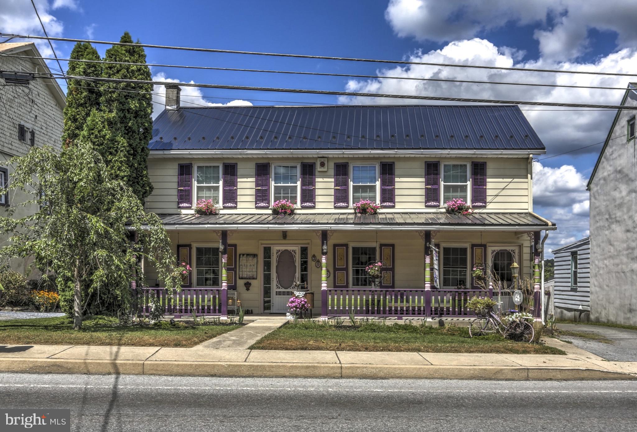 Step back in time with modern comfort in this charming Victorian-era “Painted Lady” nestled in the heart of Historic Churchtown. This beautifully preserved home dated from 1870 features gorgeous hard and softwood floors, large and inviting rooms perfect for both casual and formal dining, and a painted kitchen with wide plank pinewood floors and all appliances included. Enjoy the convenience of first-floor living with an optional 4th bedroom or office offering private outside access, plus a full bath, laundry, and mudroom on the main level. Zoned within the Churchtown Village District, this property offers flexible potential for home, business, or both. Upstairs, you’ll find three spacious bedrooms and a full bath complete with a classic clawfoot tub and pedestal sink. Outside, a detached garage and an impressive 20x40 workshop/mancave await, with a quiet rear porch overlooking scenic Lancaster County farmland. Recent updates include a new roof, updated bathroom, a water softener with reverse osmosis water treatment system, full attic, basement for storage, and a history as a former gift shop, this home offers endless possibilities — all just minutes from the PA Turnpike. A true must-see!