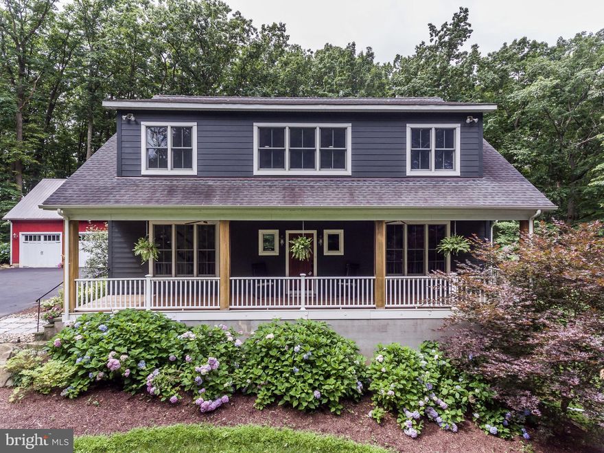 Impeccably built farmhouse meets craftsman custom home. Sought after 1st floor master suite. 2 story bright & open family room off of custom kitchen. Outdoor fireplace, large deck, portico, for easy summer living. Three car garage with space to finish above. Movie room, possible in law suite with private side entrance in LL. Whole house wired for high speed connection. Surrounded by protected land