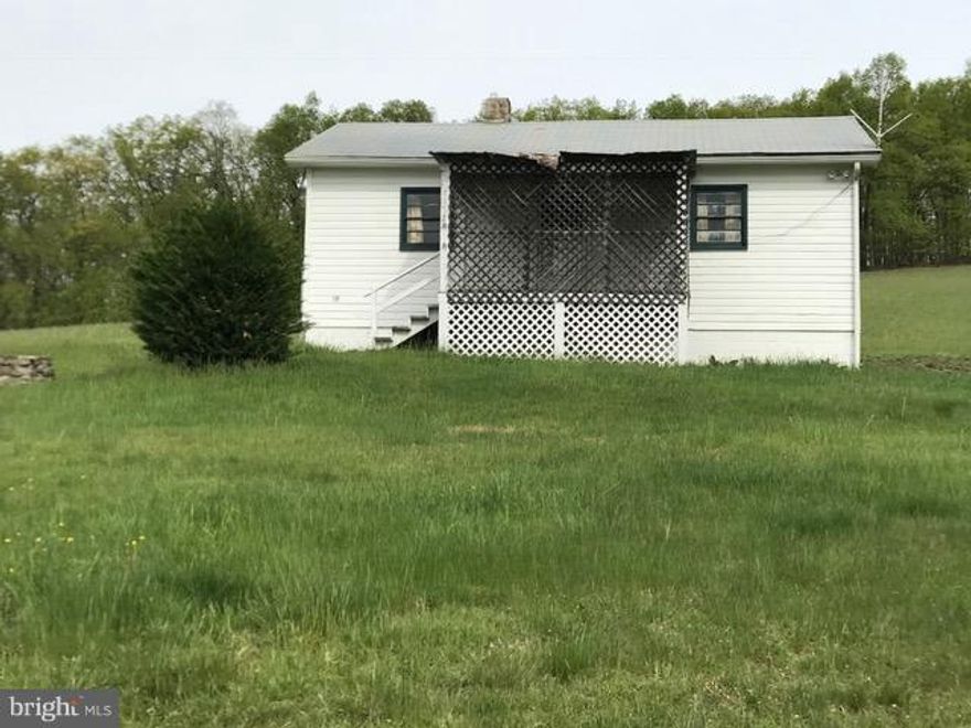 Subdivision possible as survey has already been done with the potential of 6 to 7 lots. There is 35.899 acres of land (per survey) with approx. 1/3 open and the remainder wooded. The 2 bedroom 1 bath home offers 738 square feet of living and there is a well/septic. This property is zoned RA- Residential/Agricultural. So live on one lot and sell the other lots or bring your animals and have a farm