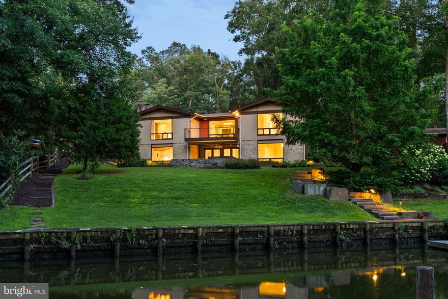 Welcome to 3010 Cunningham Drive - an exceptional mid-century modern home offering 88 feet of serene waterfront on navigable Little Hunting Creek. Rarely available with water views of Little Hunting Creek from nearly every room and a seamless connection to nature, this River House model is designed for both effortless living and elegant entertaining. Step inside to find an open main-level floor plan with striking wood-accent ceiling in the recreation rooms, recessed lighting throughout, large windows flooding the room with natural light, and a gourmet eat-in kitchen featuring stainless steel appliances and granite countertops. Host with ease in the formal dining room that opens to a spacious Trex deck—ideal for alfresco dining and enjoying tranquil views. With 2,970 finished square feet, 5 bedrooms and 3 full bathrooms, the home offers space for both privacy and togetherness. The primary bedroom retreat is a sanctuary of its own, complete with an ensuite bath, walk-in closet, and picture-perfect views to greet you each morning. Outside, the beautifully landscaped grounds and extensive hardscaping create a peaceful oasis. Relax on the slate patio (with hot tub!) or follow the private walkway to your floating dock—perfect for launching a kayak or simply enjoying the water. A 2-car garage and driveway provide ample parking, and the location offers the best of Alexandria living with the peace of a private waterfront escape. Whether you're looking to unwind or entertain, this Wessynton waterfront home delivers a lifestyle of comfort, beauty, and connection to nature. Property comprised of two lots (1111 12 0051 & 1111 12 Q1). Taxes on the "outlot" are approximately $12.00 per year. Although shown as a "recreation" association, this water-front property's second association is the Wessynton Marine Association; annual fees are listed as "recreation," and are NOT optional. There are separate disclosure packages for the Wessynton Home Association and the Wessynton Marine Association. Key documents are posted on the neighborhood website in Association Information and in Special Features