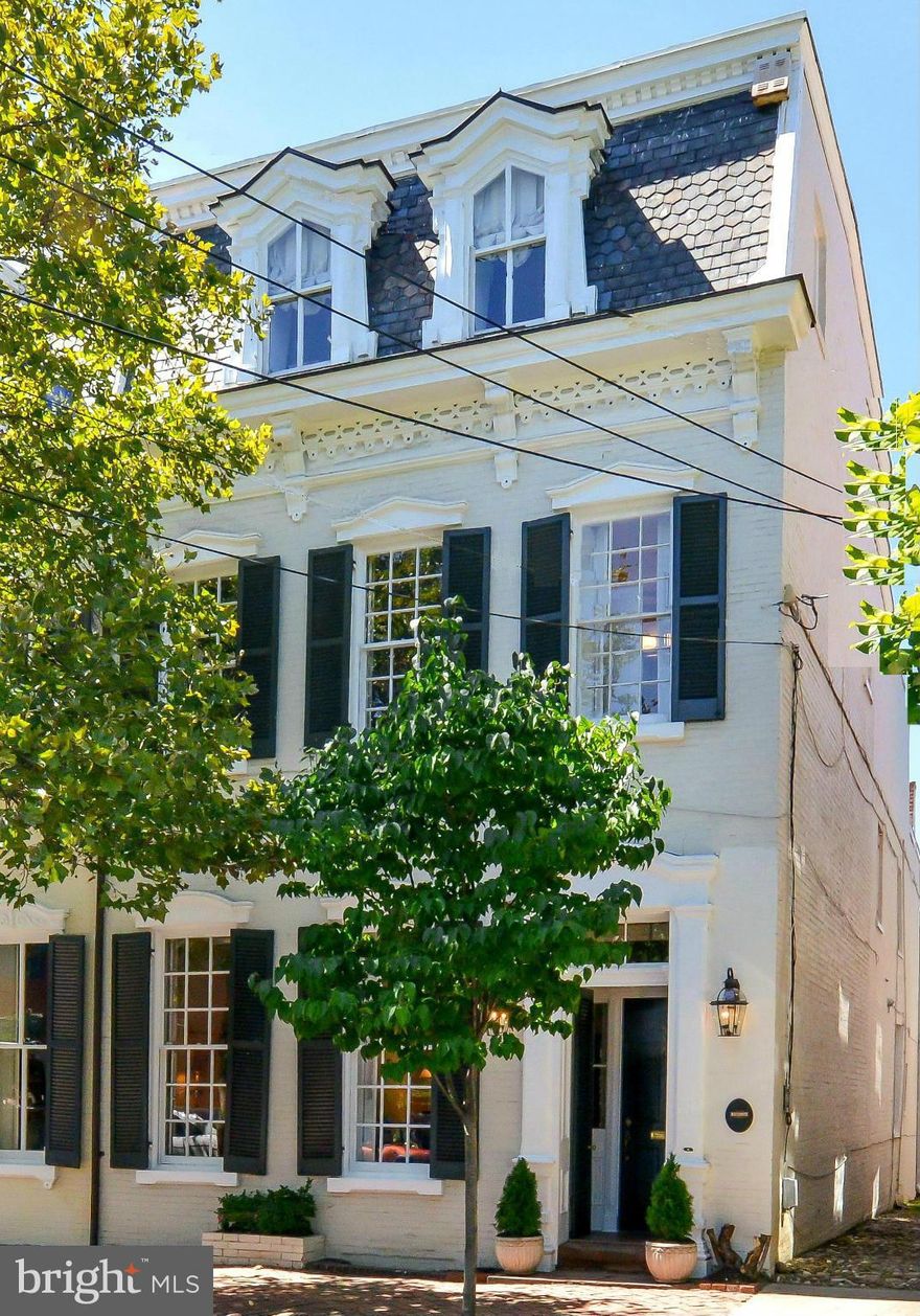 Live in a piece of history where historic integrity has been maintained.  Wonderful home, built in 1840, just blocks from King St.  Great light from windows on 4 sides. Fabulous gourmet EIK, designed & installed in '13. 4 spacious BR's, 4 FB's, library & finished lower level FR.  Great storage.  High ceilings, formal living & DR rooms & beautifully landscaped patio/garden.  Ask agent about pkg.