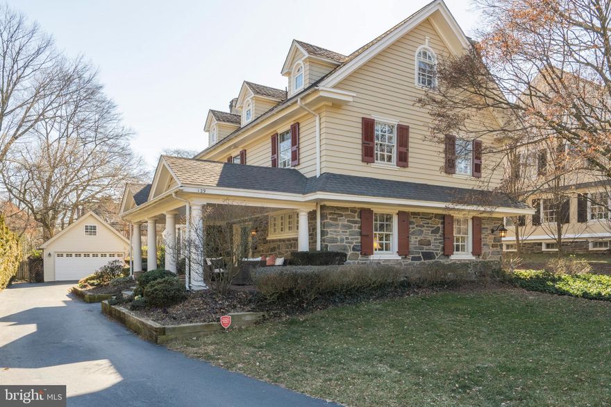 Fabulous "Urban Suburban" grand center hall colonial located on a stately tree-lined street in a fabulous walk-to location in North Side Ardmore with incredibly LOW taxes! Located in the Lower Merion School District and blocks from Suburban Square shopping (Trader Joes, Apple, etc. plus many restaurants as well as the popular LIFETIME Fitness). For those wanting public transport, this location is ideal w/ Ardmore Septa station stop only a few blocks away that is a short ride to Center City and also is an AMTRAK stop taking you directly to NYC! Inside, this home is elegant and grand at the same time w/ 5 bedrooms, 3 completely updated full & 2 half baths, gorgeous kitchen and family room addition, detached 2 car garage and flat rear yard! Approaching 129 Valley Rd, you can't help but fall in love with the wonderful and private covered porch, perfect for relaxing afternoons or morning coffee. Step inside and you will surely appreciate the elegant yet large foyer with a welcoming view into the living and dining rooms. To the right, the formal living room is spacious and inviting with a wood burning fireplace and plenty of large windows to drench the room with sun. The dining room is elegant with its rich wainscoting and wood-burning fireplace surrounded by gorgeous built in cabinetry. The fully renovated, custom gourmet kitchen has bright white cabinets, commercial grade appliances, soap stone countertops, glass tile backsplash, a full wall of floor to ceiling cabinetry and a large center island. In addition, there is plenty of room in the kitchen for a full table, perfect for casual meals together. Off the kitchen is the highly coveted family room addition with two full walls of windows providing the perfect amount of light and warmth. From the kitchen and family room areas are French doors leading to the flagstone patio and flat rear yard. Off the kitchen is washer/dryer and additional pantry storage. Finishing off this floor is a pristine half bath. Upstairs discover a large master bedroom w/ gas fireplace, built-in bookshelves, 2 walk-in closets & large master bathroom w/ Jacuzzi tub, floor to ceiling shower and double vanity. Down the hall from the master bedroom are two additional, large bedrooms and a fully renovated hall bath with frameless glass doors. Continue up the wide and elegant stairs to an open 3rd floor which offers 2 additional bedrooms and a delightful 3rd full bath, complete with frameless glass enclosed tile shower and tile floor. Completing this floor is a hall linen closet and unfinished storage room. Downstairs, the basement is dry and partially finished adding an extra 860 square feet of living space that is not included in public records. Note a licensed appraiser measured the square footage of this home prior to listing and found the actual square footage to be 3900 not including the additional 860 square feet in the basement! Valley Road is a delightful and friendly street with frequent neighborhood gatherings, block parties and a true sense of community. 129 Valley Road is not to be missed with its grand and classic elegance that has been completely updated, varied and mature plantings, low taxes, award-winning schools and an unbeatable walk to everything location!