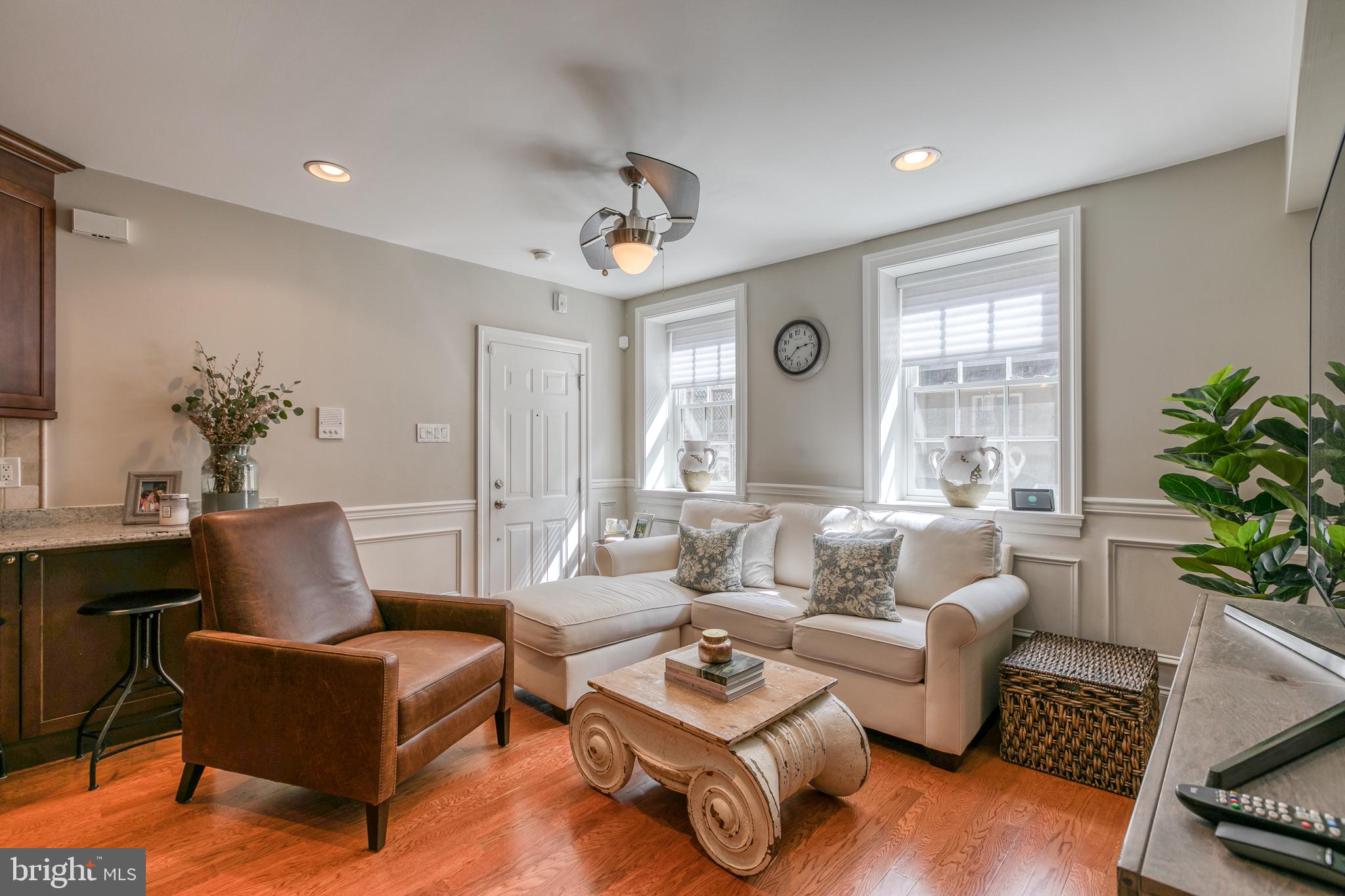 Don't miss your chance to own in the heart of Rittenhouse Square. You'll love this light-filled first-floor condo with hardwood floors, open floor plan, and plenty of storage space. The first floor features a living room, kitchen, one-bedroom, and one bathroom. The lower level opens up into a large open space perfect for a den, office currently being used as a nursery. The extra-wide hallway leads to the laundry closet with newer washer and dryer, as well as the second bedroom with a full tile bath and updated countertop. This floor also has tons of closet space that has been customized for accessibility. Two entrances can be used to access your unit...Use the main entrance on Pine Street or pull up in the back and bring your groceries in from Waverly Street.