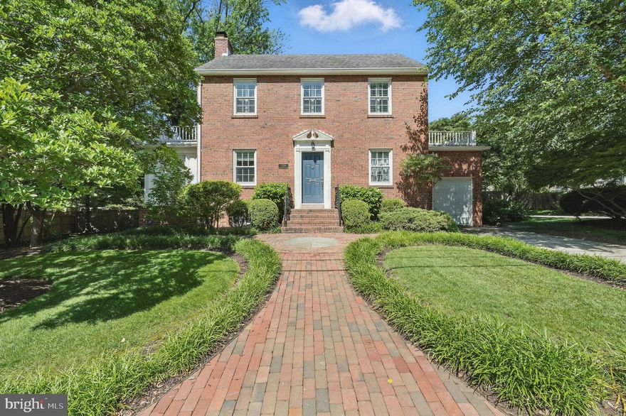 Welcome to a beautifully detailed residence where classic charm meets thoughtful updates, beginning with a circular brick walkway that winds around the house to flagstone stepping stones and a private, landscaped yard. Inside, the foyer offers a gracious first impression with arched openings that lead to the formal dining room on one side and the living room on the other—each space grounded by hardwood floors that run throughout the main level.

The formal living room features a fireplace, abundant natural light from double exposure windows, and a wall lined with custom built-in bookcases. Just beyond, a private office addition offers a quiet retreat with exposed brick, plantation shutters, a built-in desk, and its own mini-split HVAC system. The dining room also enjoys double exposure and flows into a well-appointed butler’s pantry with beautiful tile backsplash and beverage fridge, as well as convenient access to a hall closet and the lower level.

A charming powder room with a unique star-patterned ceiling, a walk-in pantry, and a practical mudroom add function and personality. The kitchen features quartz counters, white tile backsplash, two-tone cabinetry in white and blue, and Café appliances. Open shelving and generous storage maximize space and style. Just off the kitchen, the family room includes built-in bookcases, cozy window seats, and double French doors opening to a large, private flagstone terrace—perfect for entertaining or quiet outdoor evenings.

Upstairs are four spacious bedrooms and two full baths. The primary suite features vaulted ceilings, a large walk-in closet, hardwood flooring, fresh paint, and an ensuite bath with dual pedestal sinks, marble flooring, and a newly installed glass shower door. The  three secondary bedrooms feature wood floors, plantation shutters, fresh paint, and pull-down attic access for additional storage. Two of the secondary bedrooms have private access to rooftop terraces, one on each side of the house. 

The finished lower level includes LVP flooring, exposed brick, and a creative chalkboard wall. There's an additional fridge, unfinished storage, a utility/laundry area, and peace of mind from a waterproofing system with French drains, sump pump, and battery backup. Heating throughout the home is provided by a boiler and radiators.

This home is a rare blend of timeless architecture and meticulous detail, offering enduring quality, generous space, and quiet sophistication in every corner.