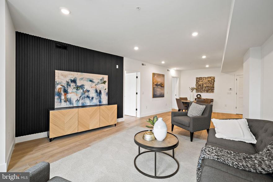 Welcome to Fifteen38 Flats, the newest luxury boutique condo building in the heart of Fishtown. Unit #4A, a spacious 1,200-square-foot residence, offers 2 bedrooms and 2.5 bathrooms, all beautifully designed. The kitchen features custom white cabinetry, quartz countertops, and stainless steel appliances, flowing into a bright, airy living room. The bathrooms boast curated tiles, elegant vanities, and modern black fixtures.
The building provides a private, secure entry off Frankford Avenue, with an elevator leading to each floor and a massive rooftop deck. Enjoy dramatic Center City Skyline views and a large dog run for your furry friend.
Located next to Philly’s top restaurants and bars, this home combines luxury and convenience. Plus, take advantage of a special interest rate with a 2-1 buy-down that the seller will cover. Check with the listing agent for the latest rate updates and other exclusive offers.  Fifteen38 Flats is more than just a home; it’s a vibrant lifestyle in one of Philly’s hottest neighborhoods.